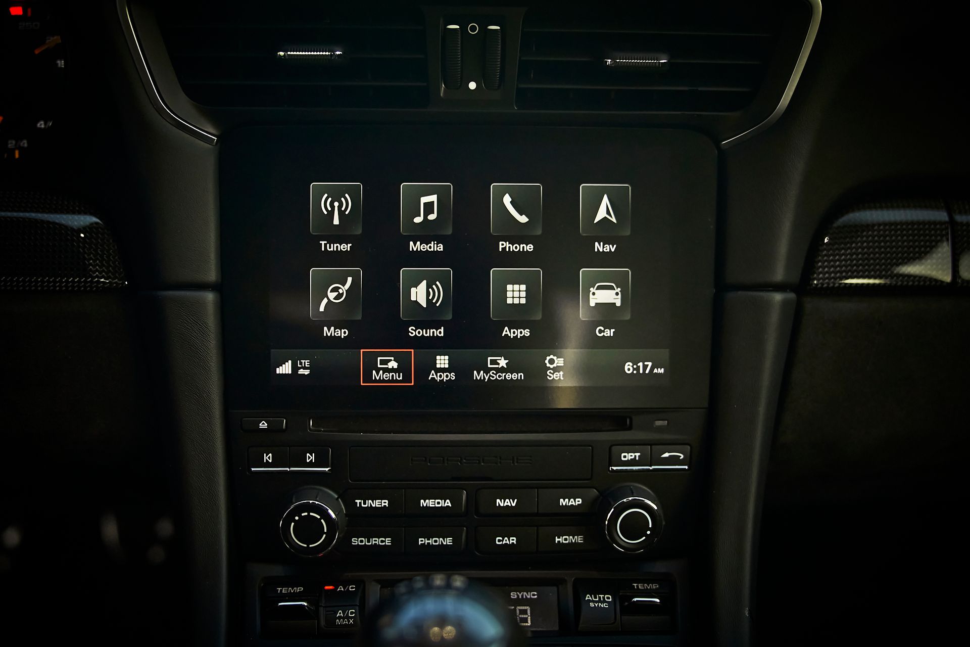A close up of a car dashboard with a touchscreen display.