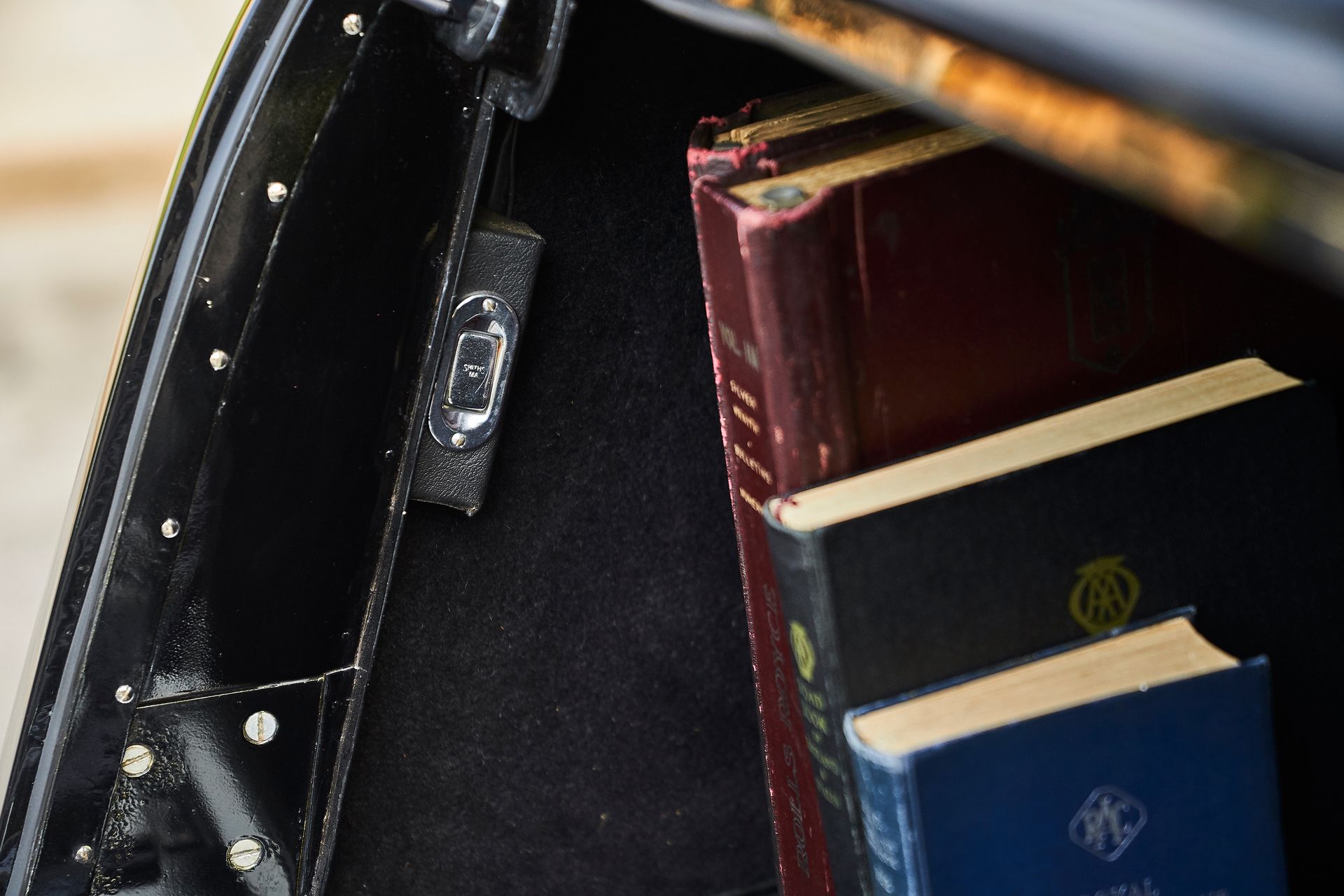 A close up of a briefcase with books in it