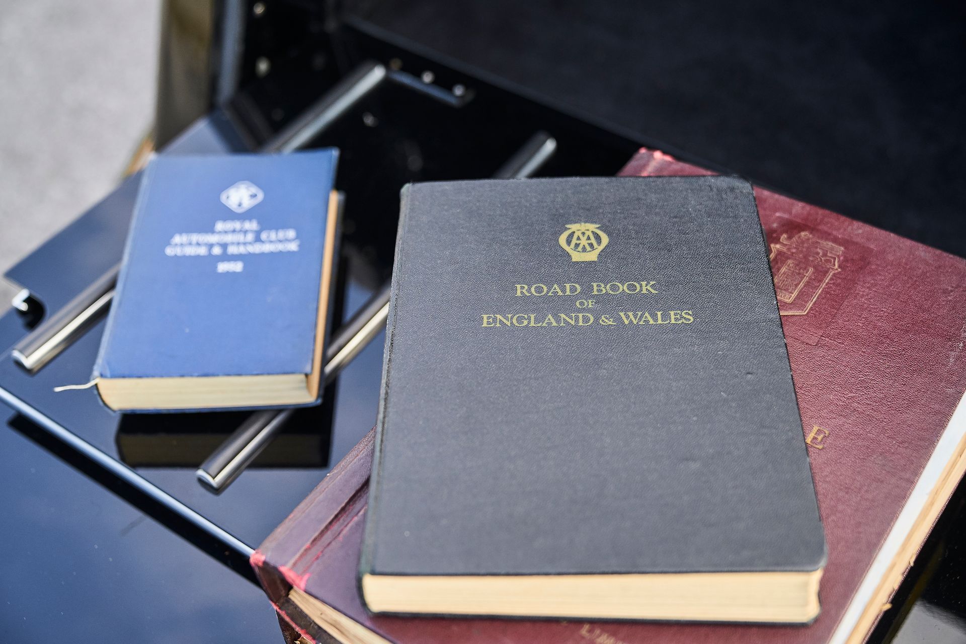 A stack of books including one titled read book england & wales