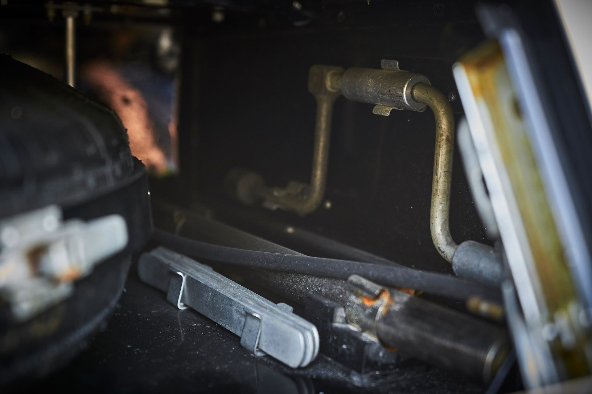 A close up of a metal object in a dark room.