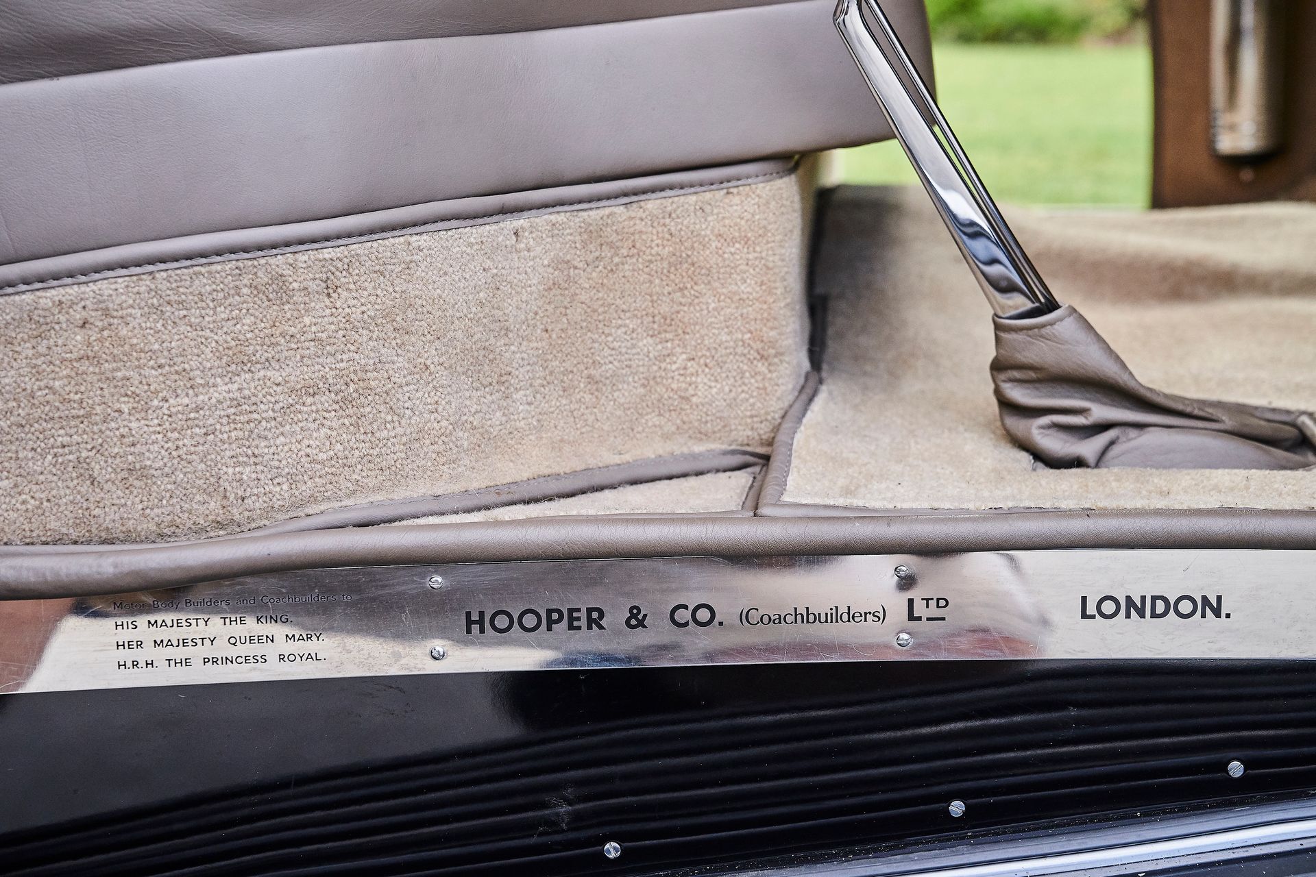 A close up of a car door that says london on it