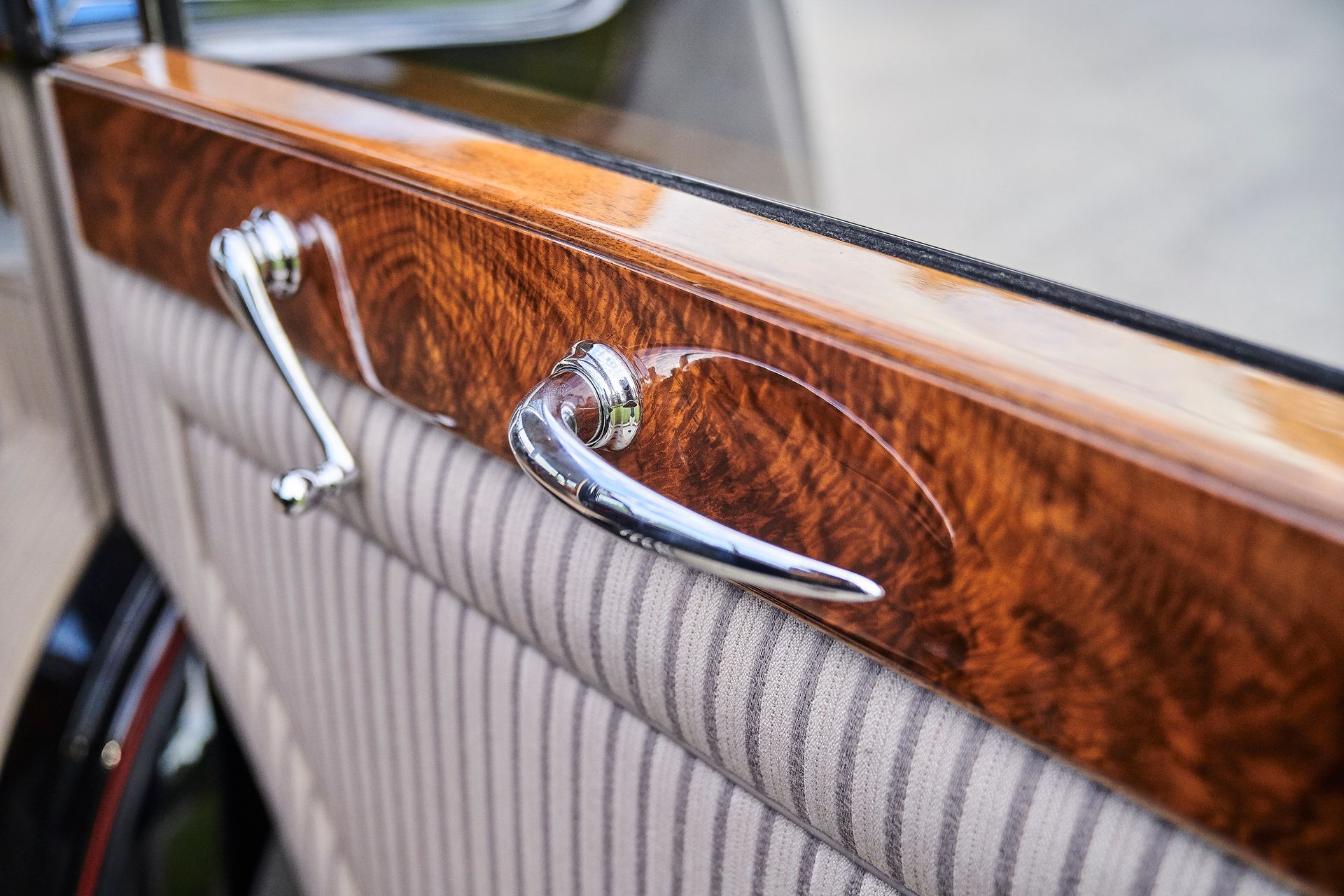 A close up of a door handle on a car.