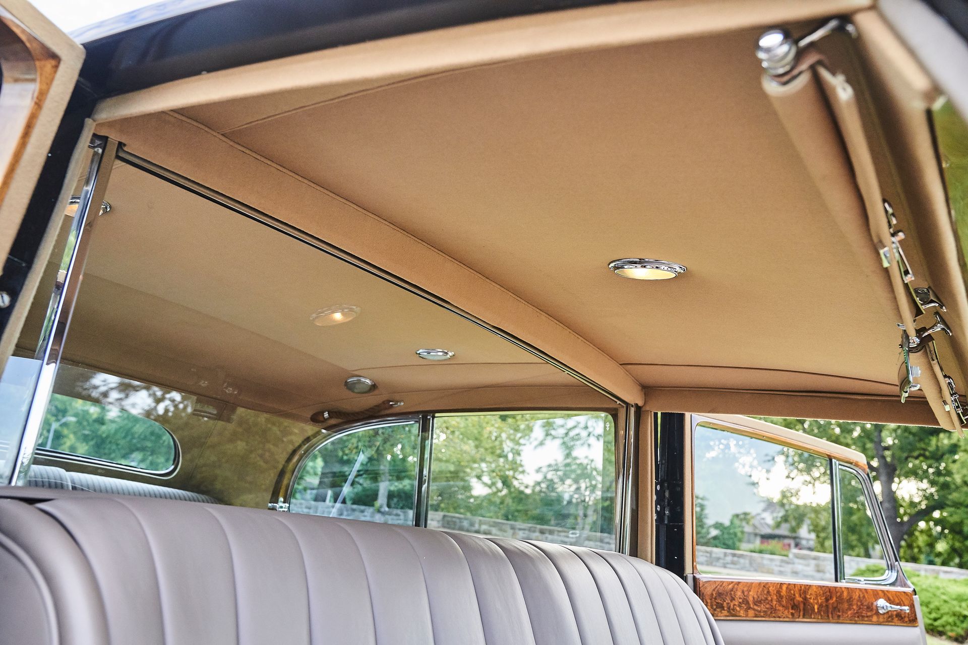 The inside of a car with a tan roof