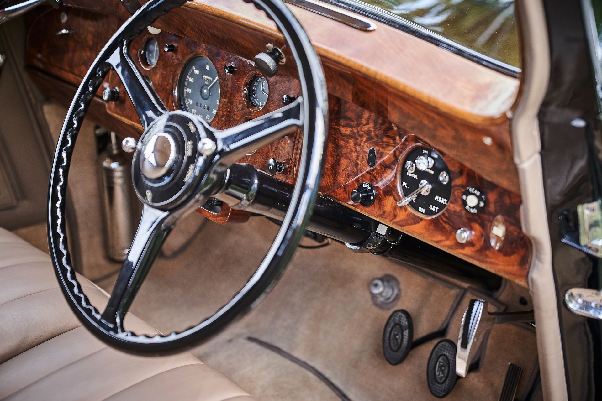 A close up of a steering wheel in a car