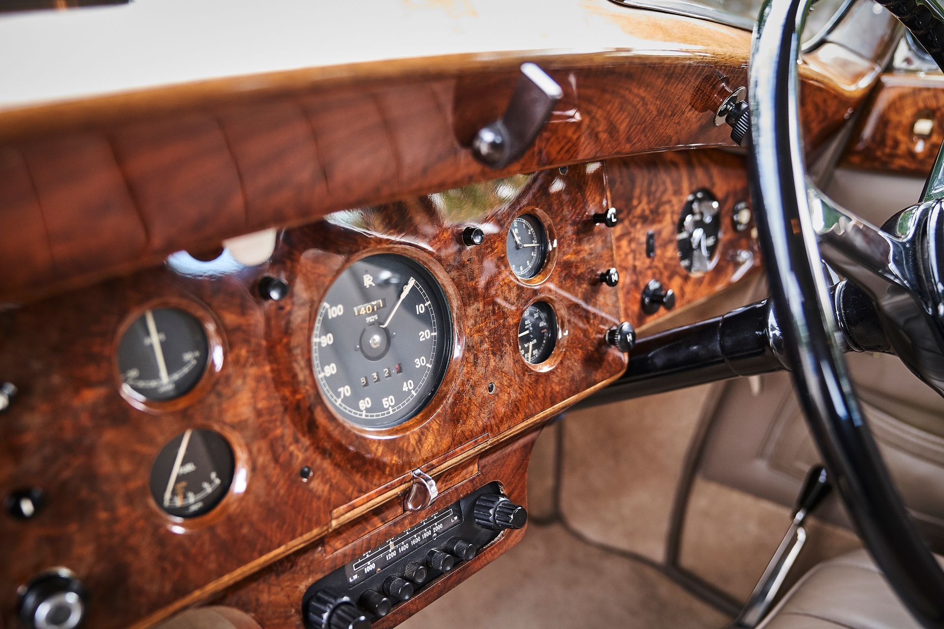 A close up of the dashboard of an old car.