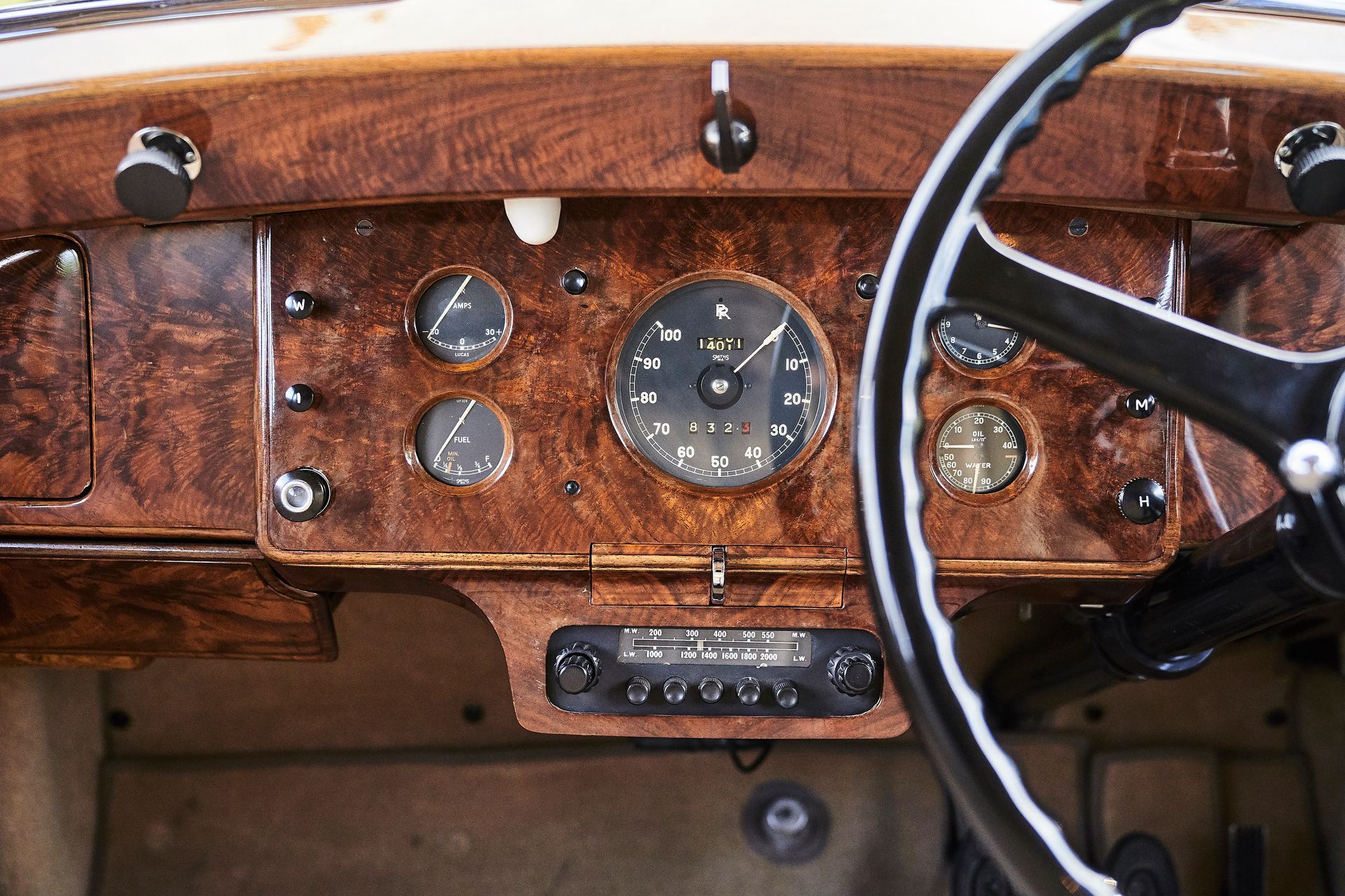 A close up of the dashboard of an old car