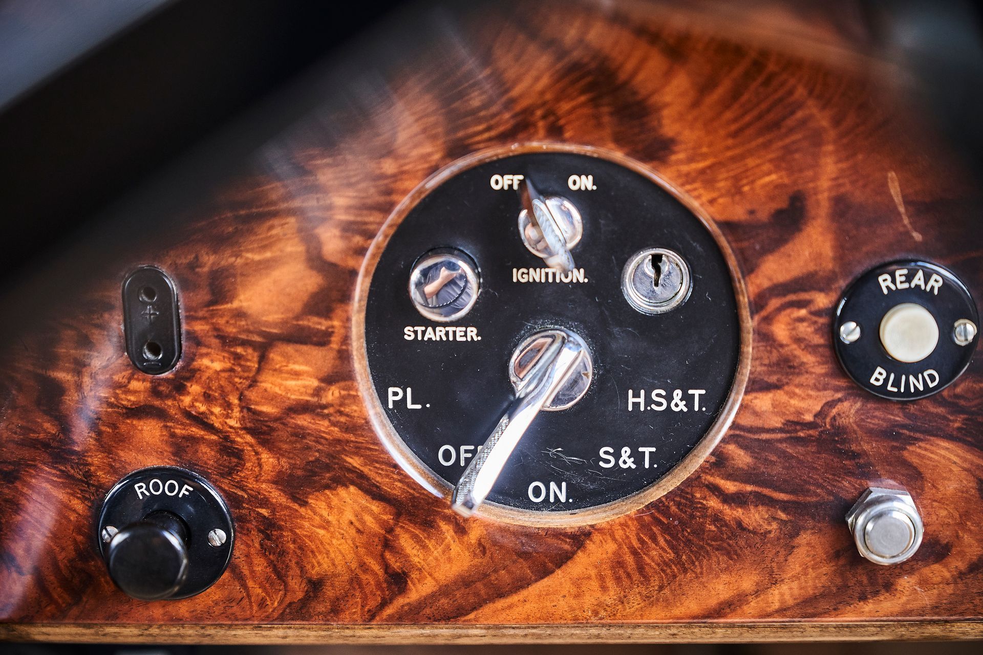 A close up of a wooden dashboard of a car