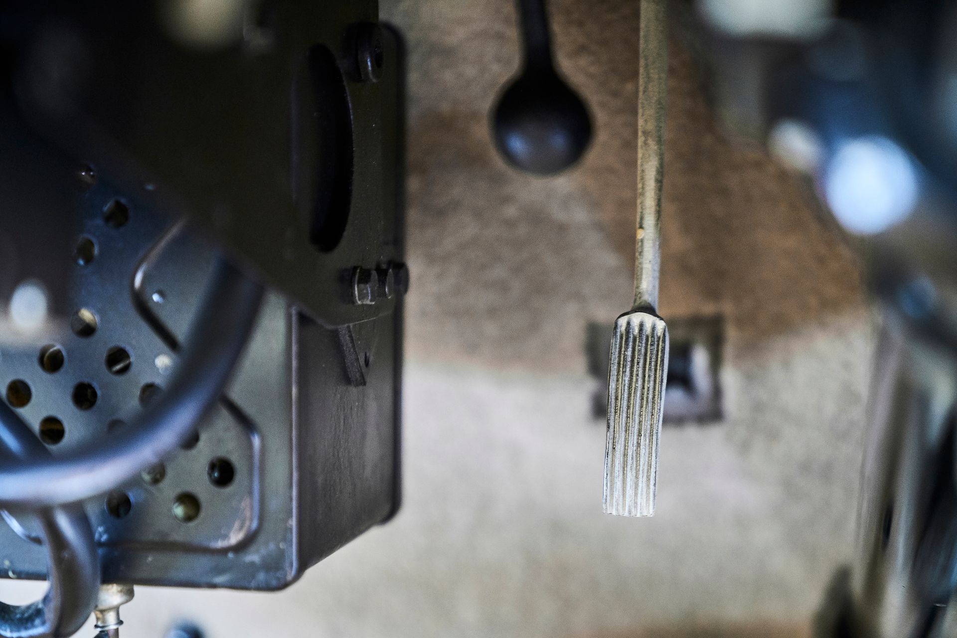 A close up of a brake pedal on a car.