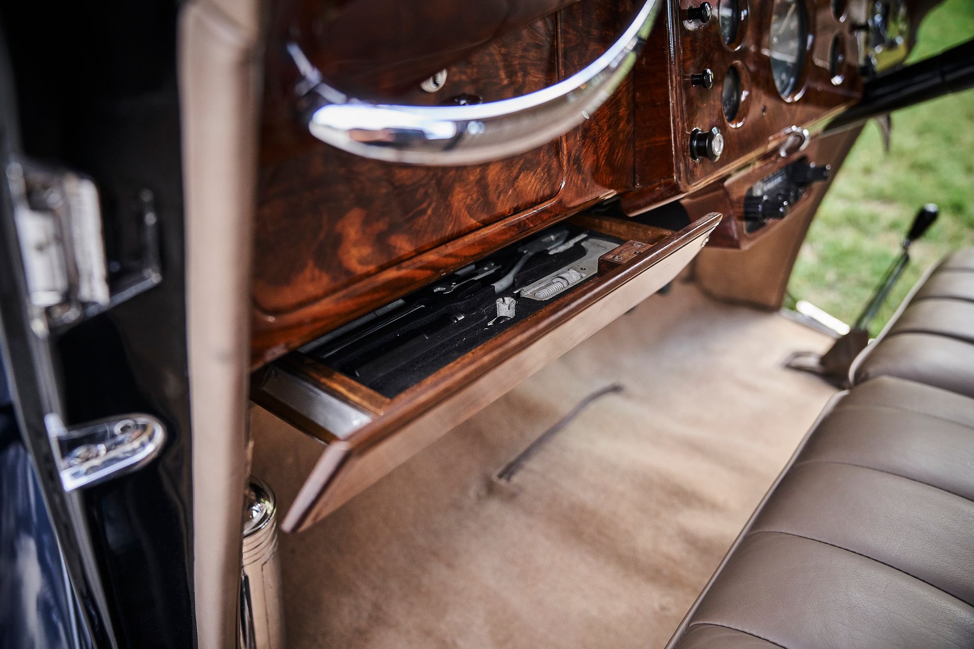 A close up of a glove box in a car.