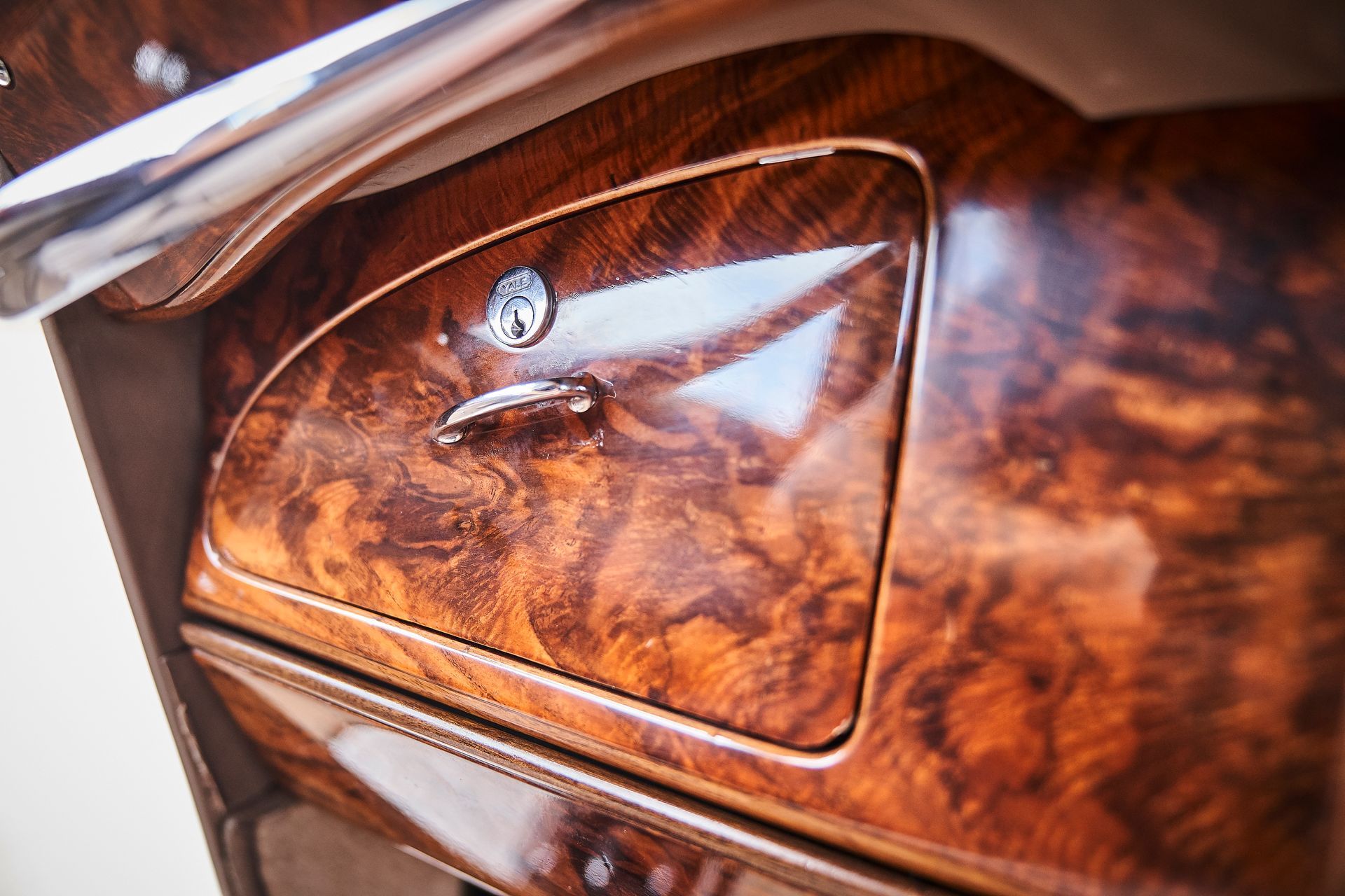 A close up of a wooden dashboard in a car.