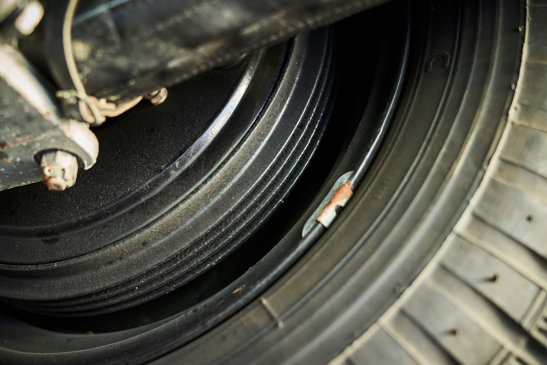 A close up of a tire with a hole in it