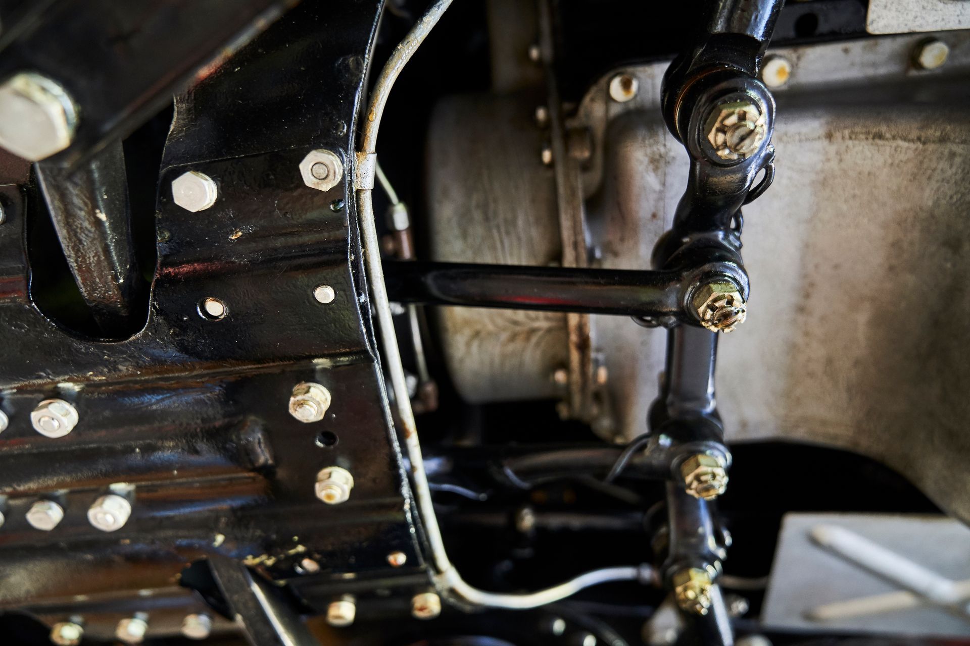 A close up of the underside of a car engine.