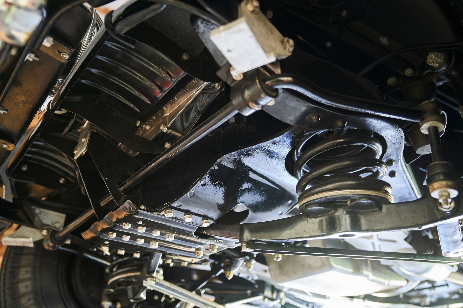 A close up of the underside of a car 's suspension system