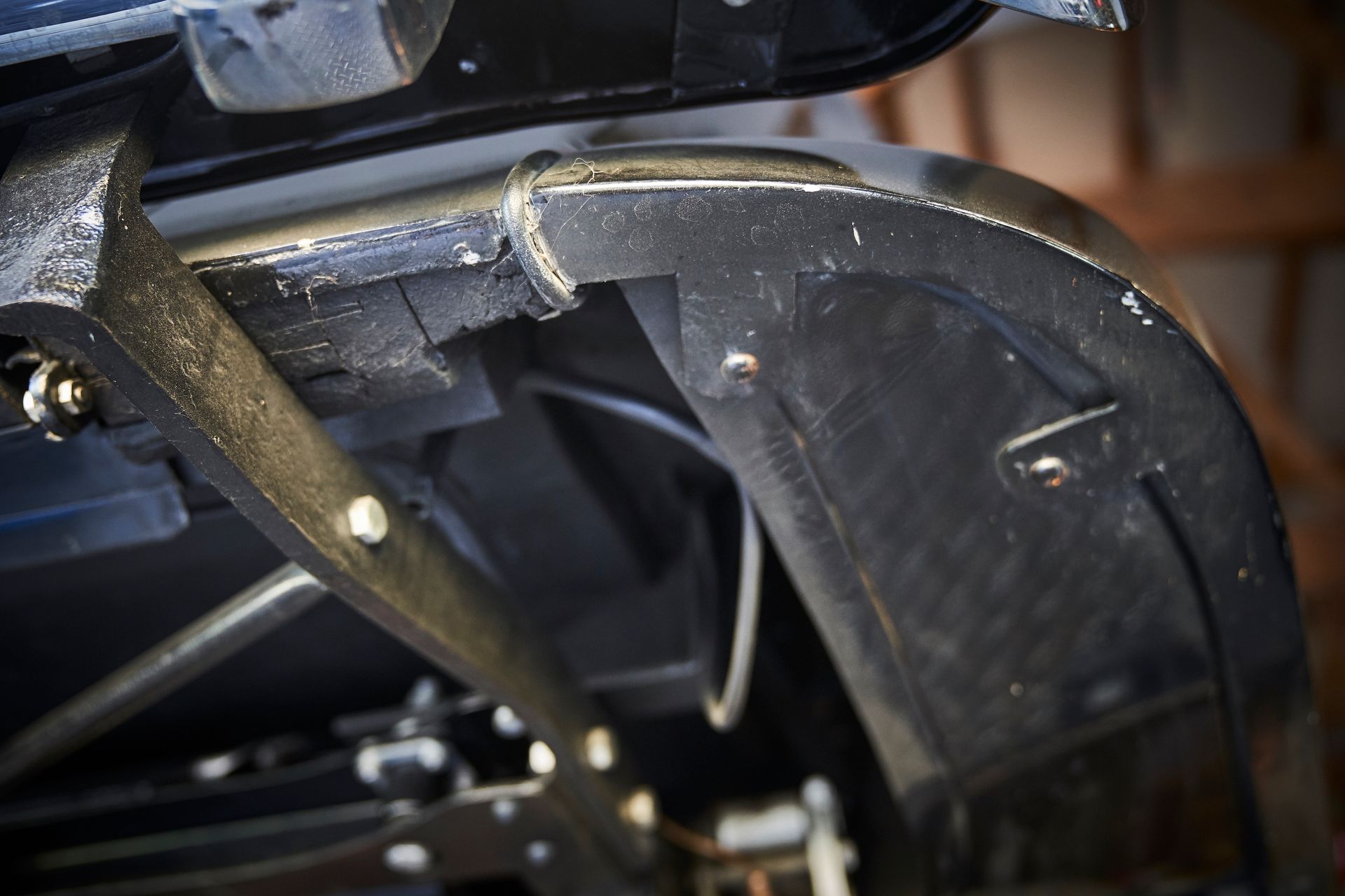 A close up of the underside of a car fender