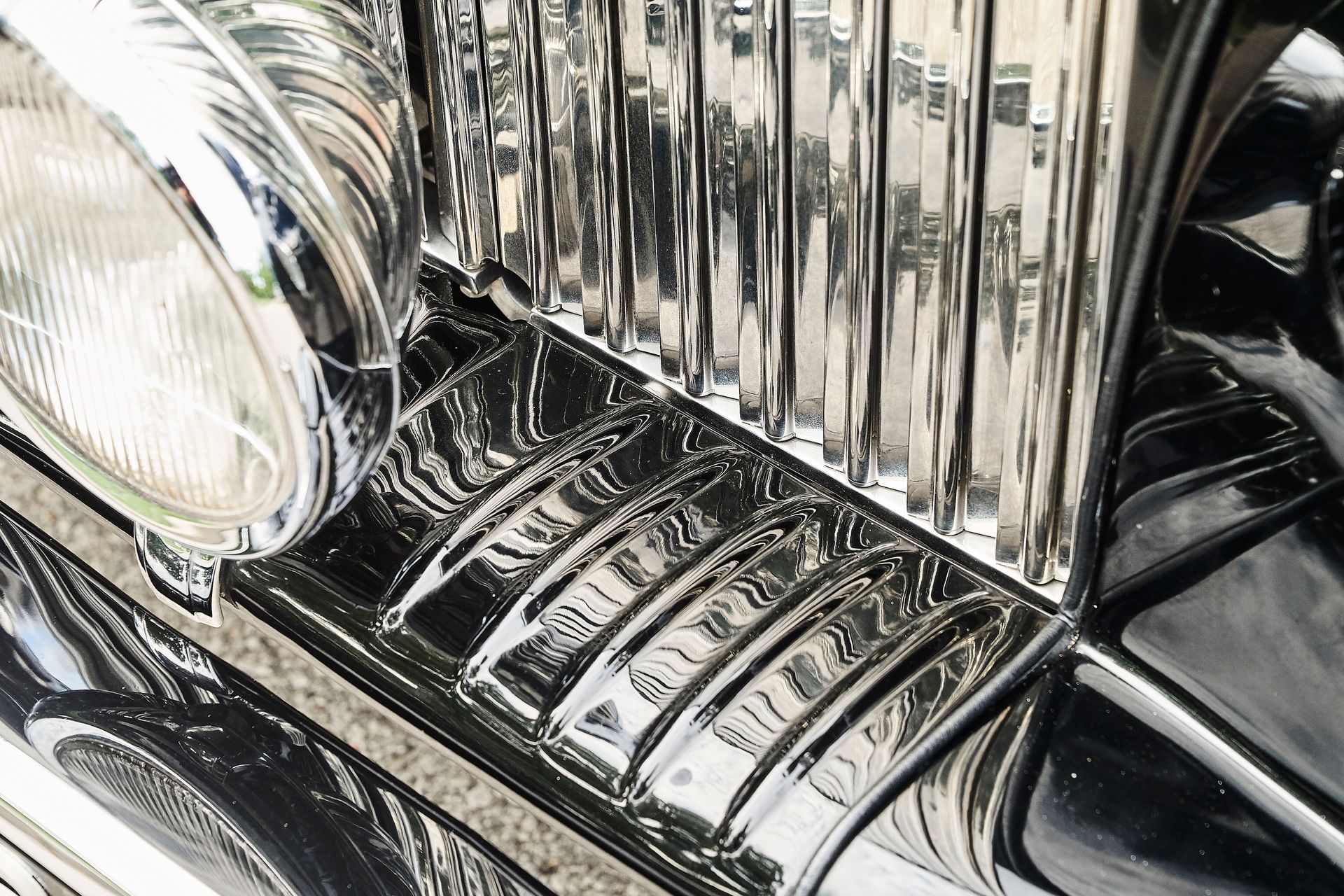 A close up of a car 's headlight and dashboard