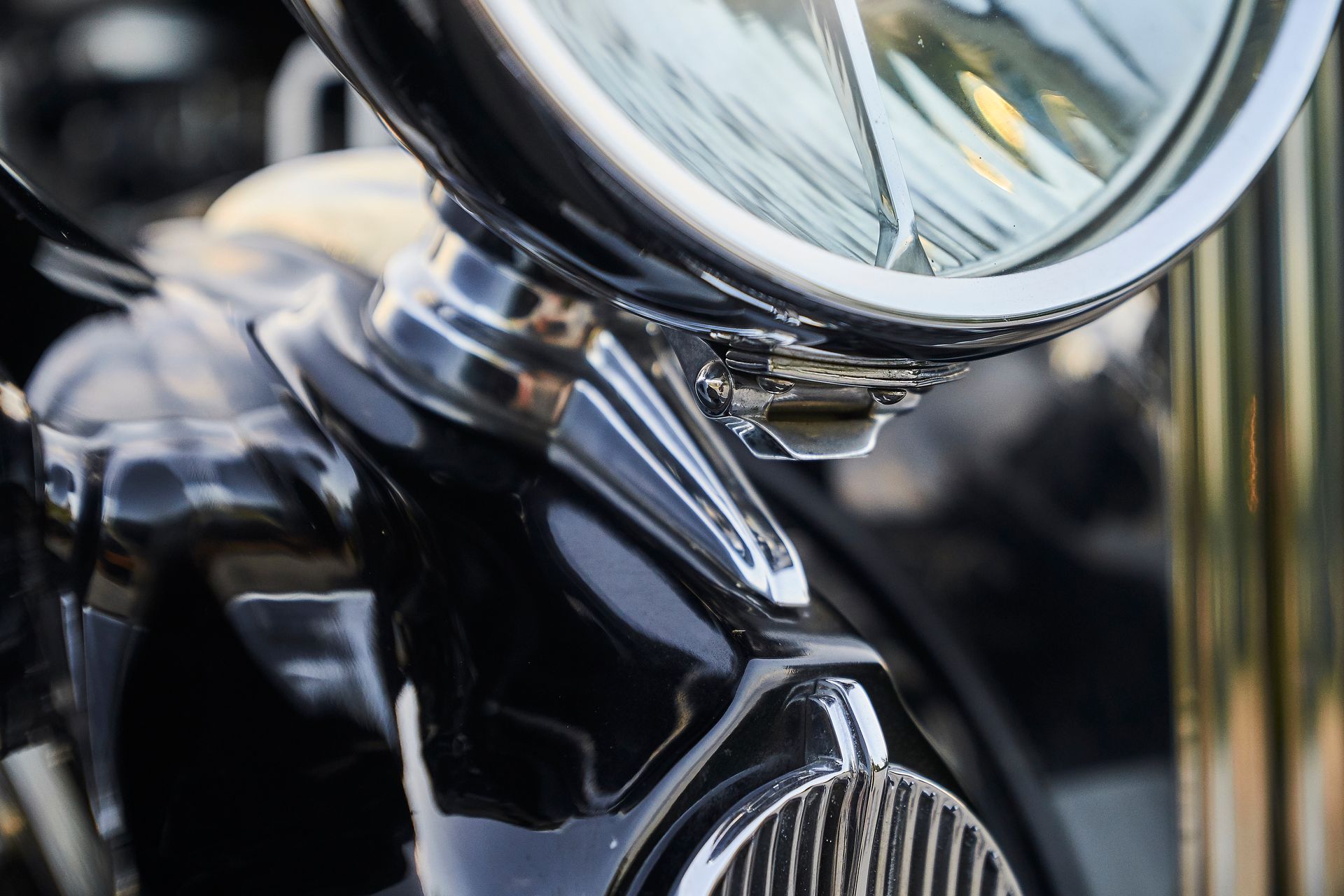 A close up of a headlight on a black car