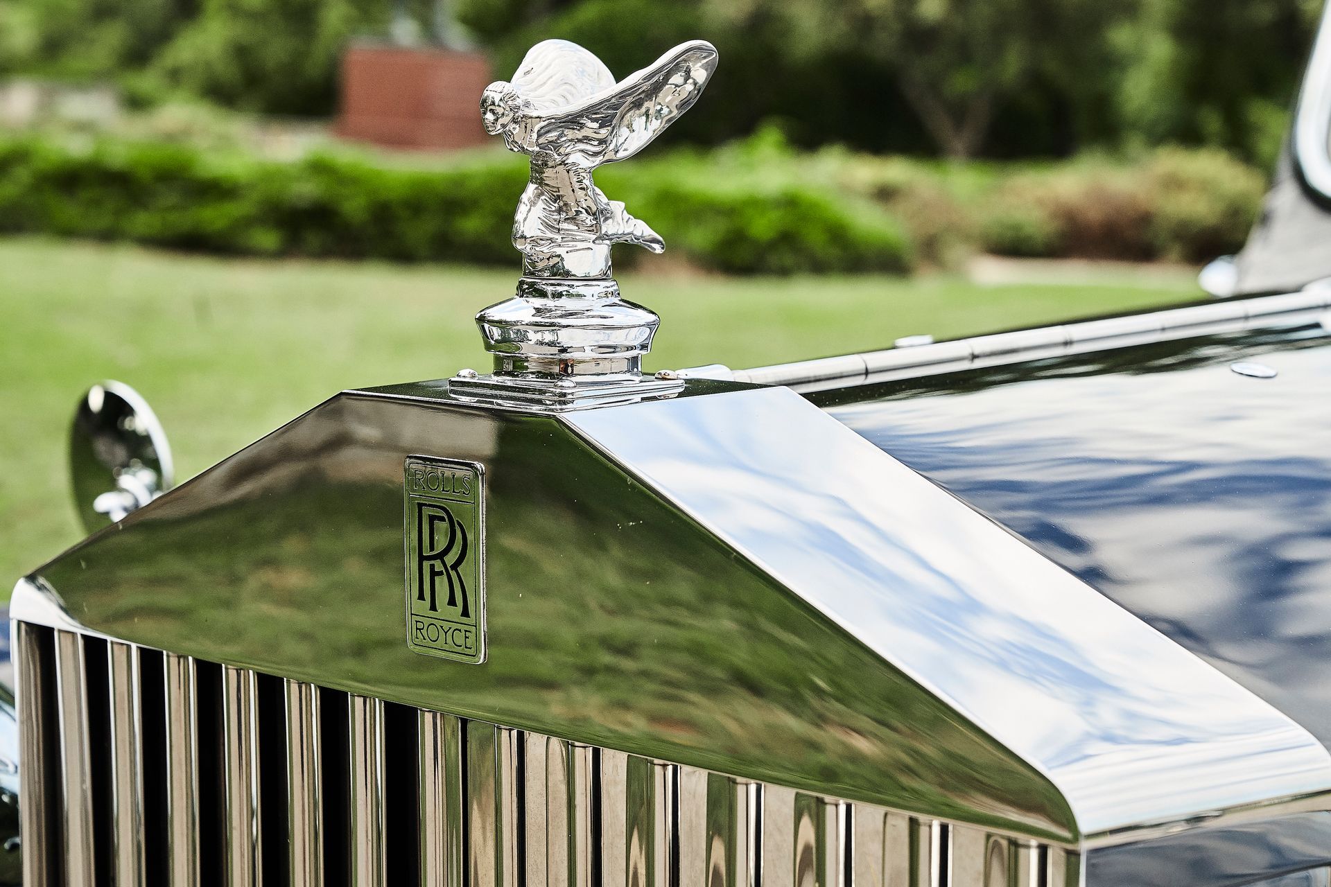 A close up of the hood of a rolls royce car