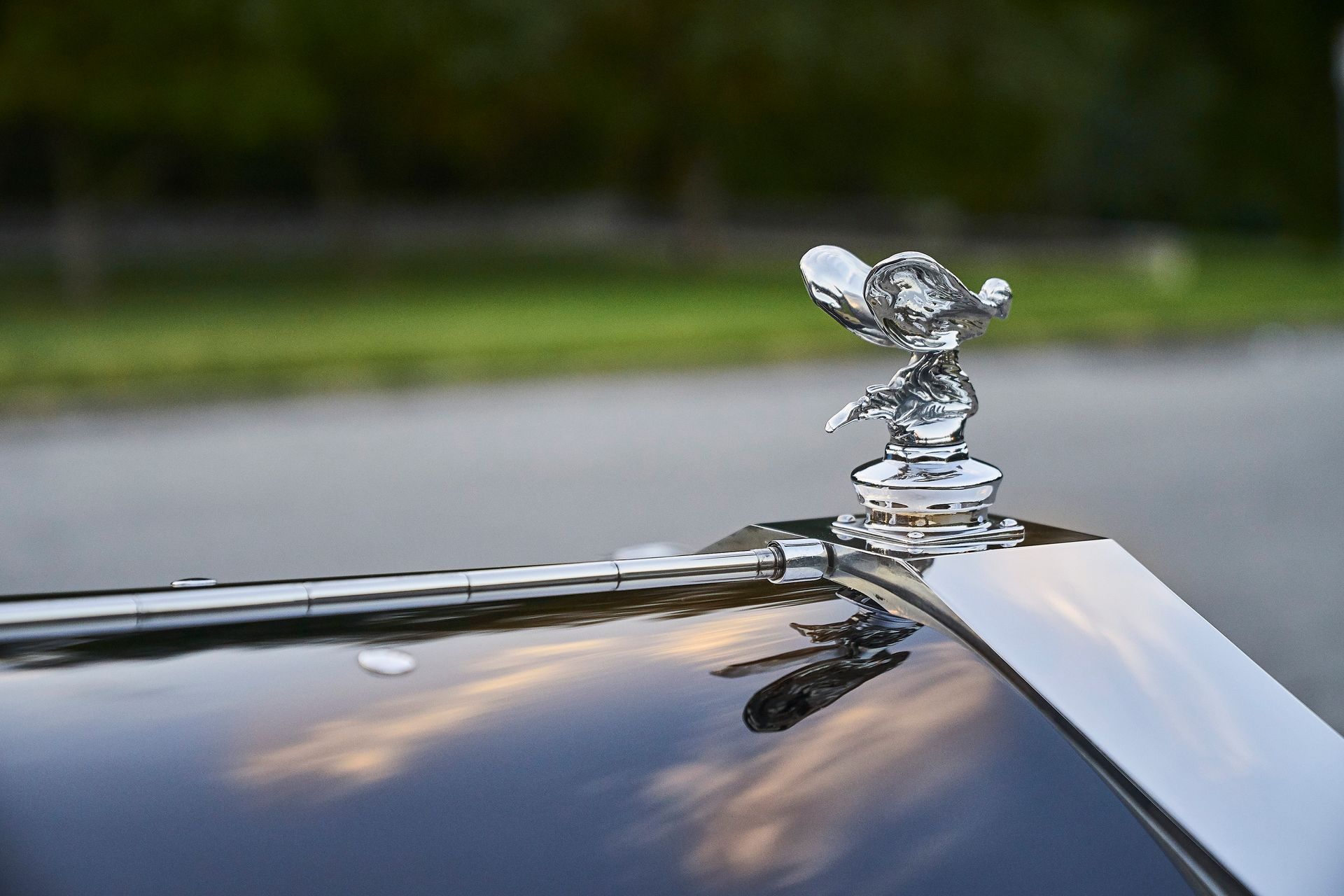 A close up of a hood ornament on a car.
