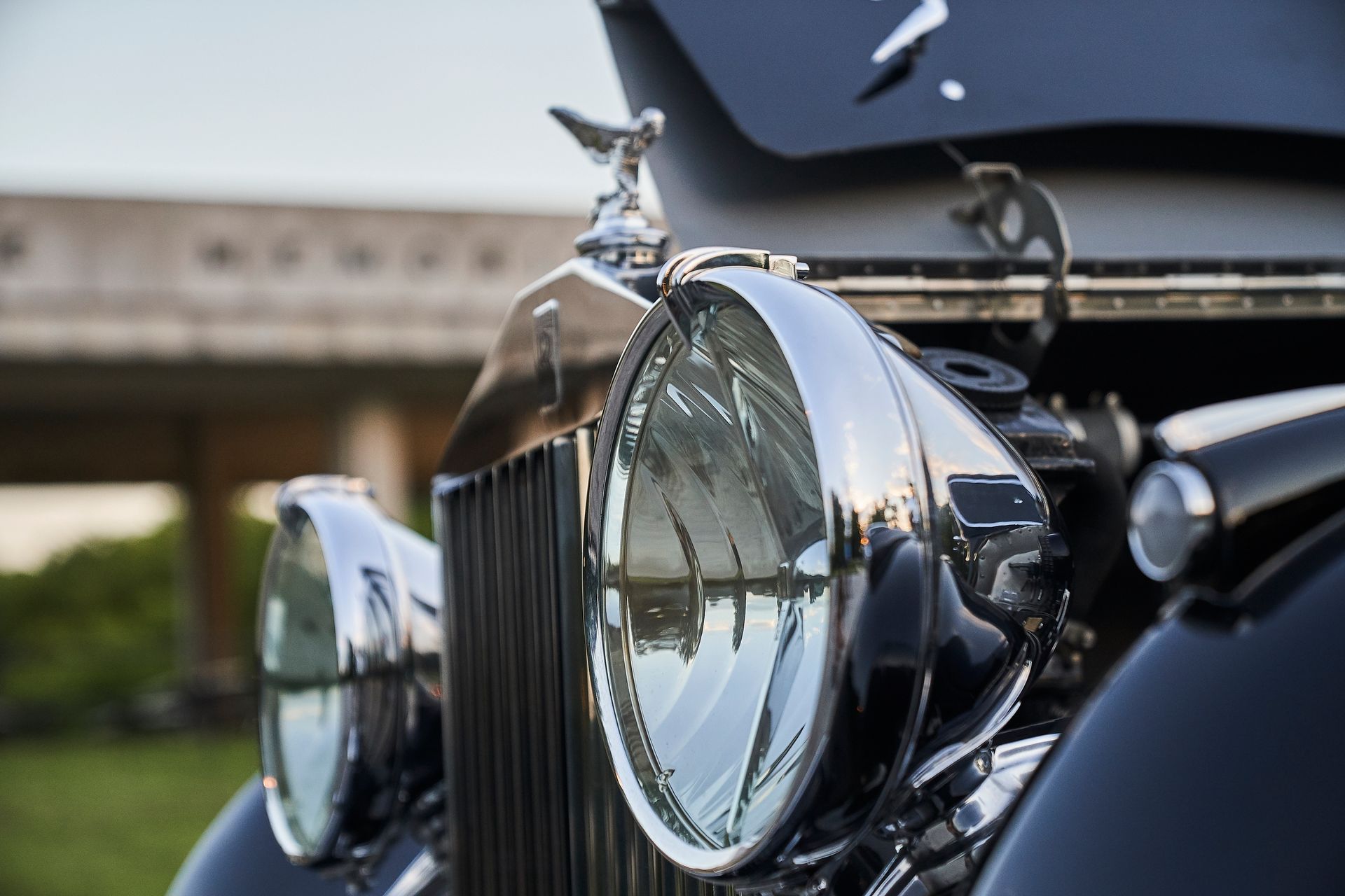 A close up of a black car with the hood up