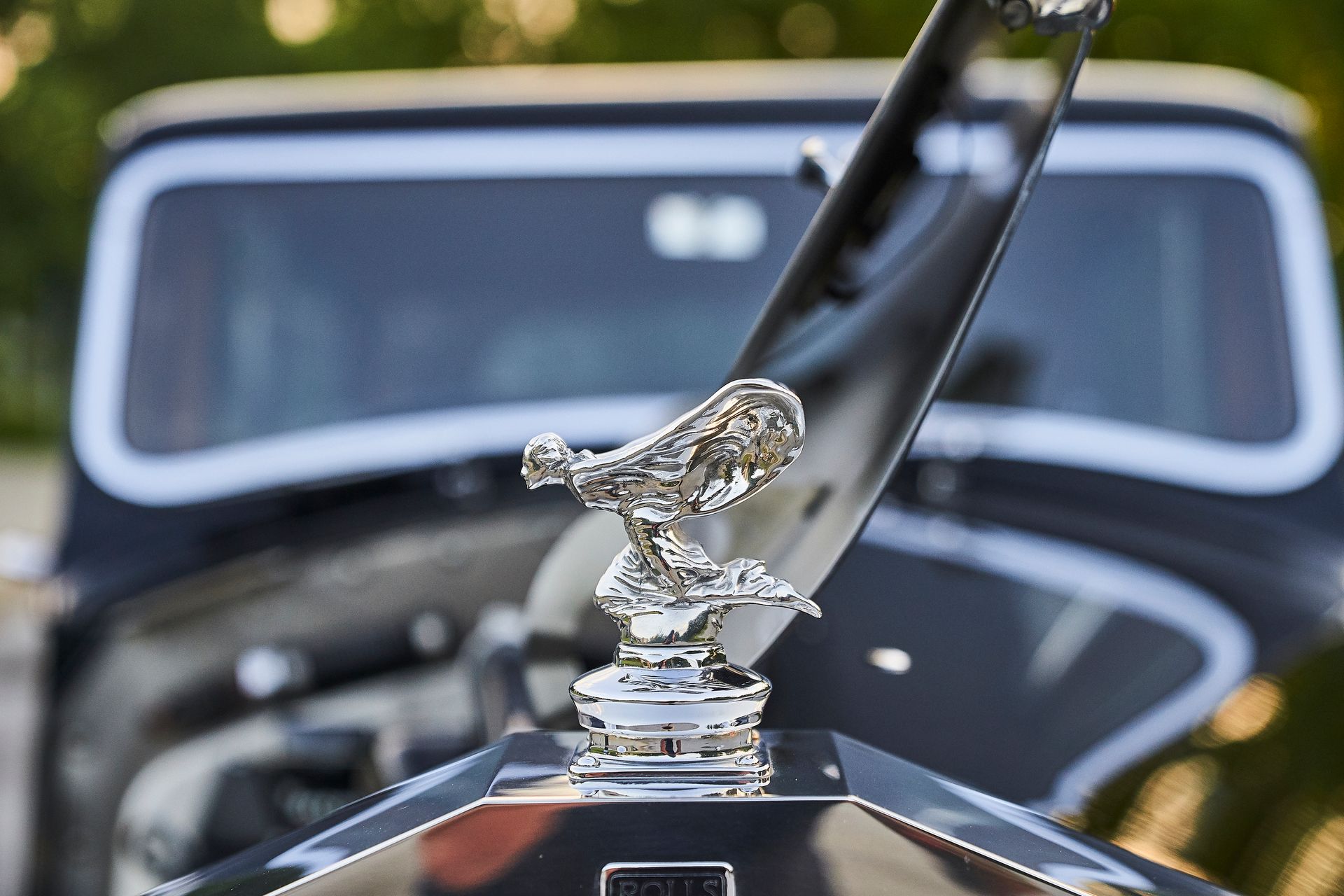 A close up of the front of a rolls royce car