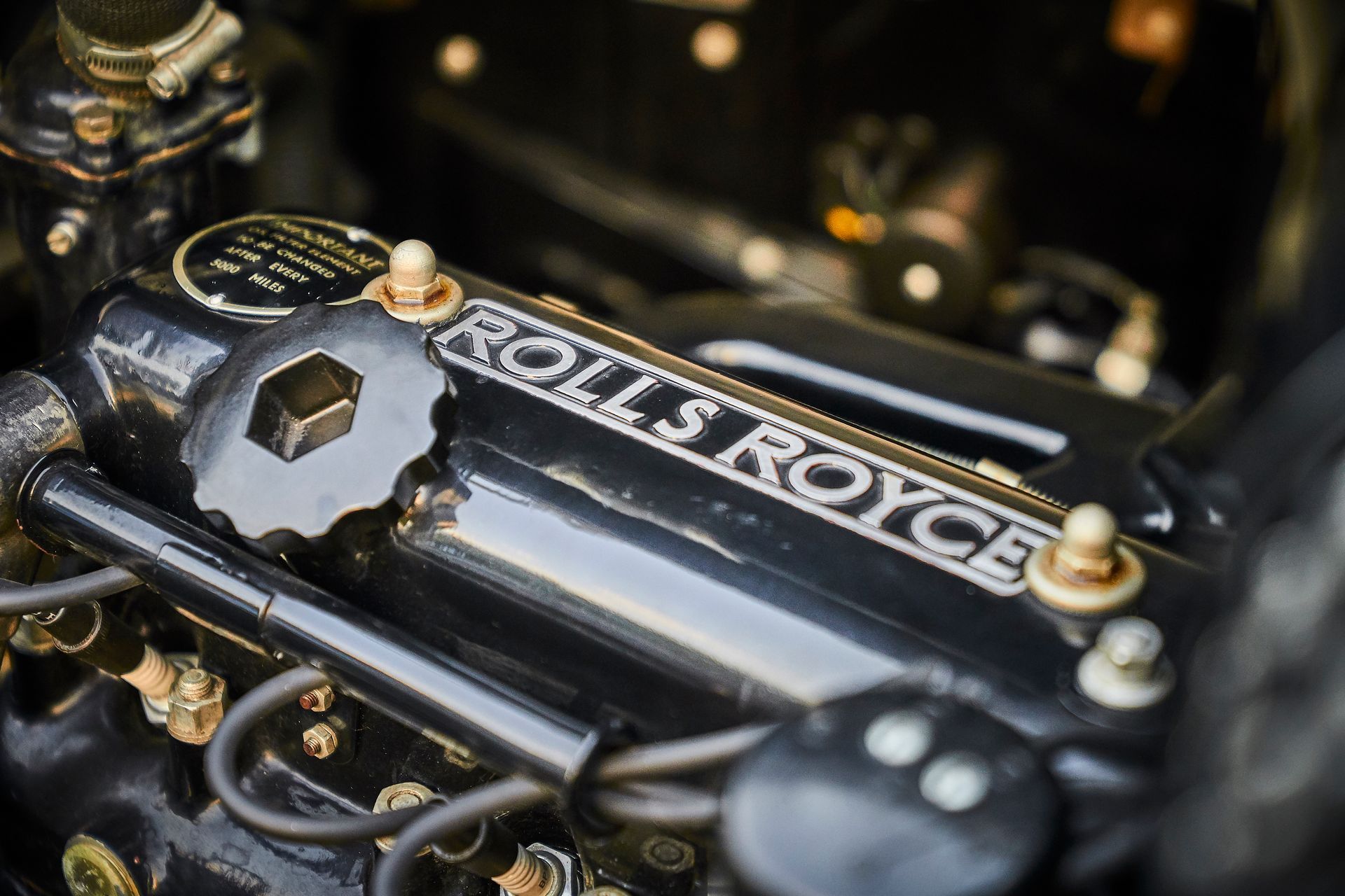 A close up of a rolls royce engine in a car.