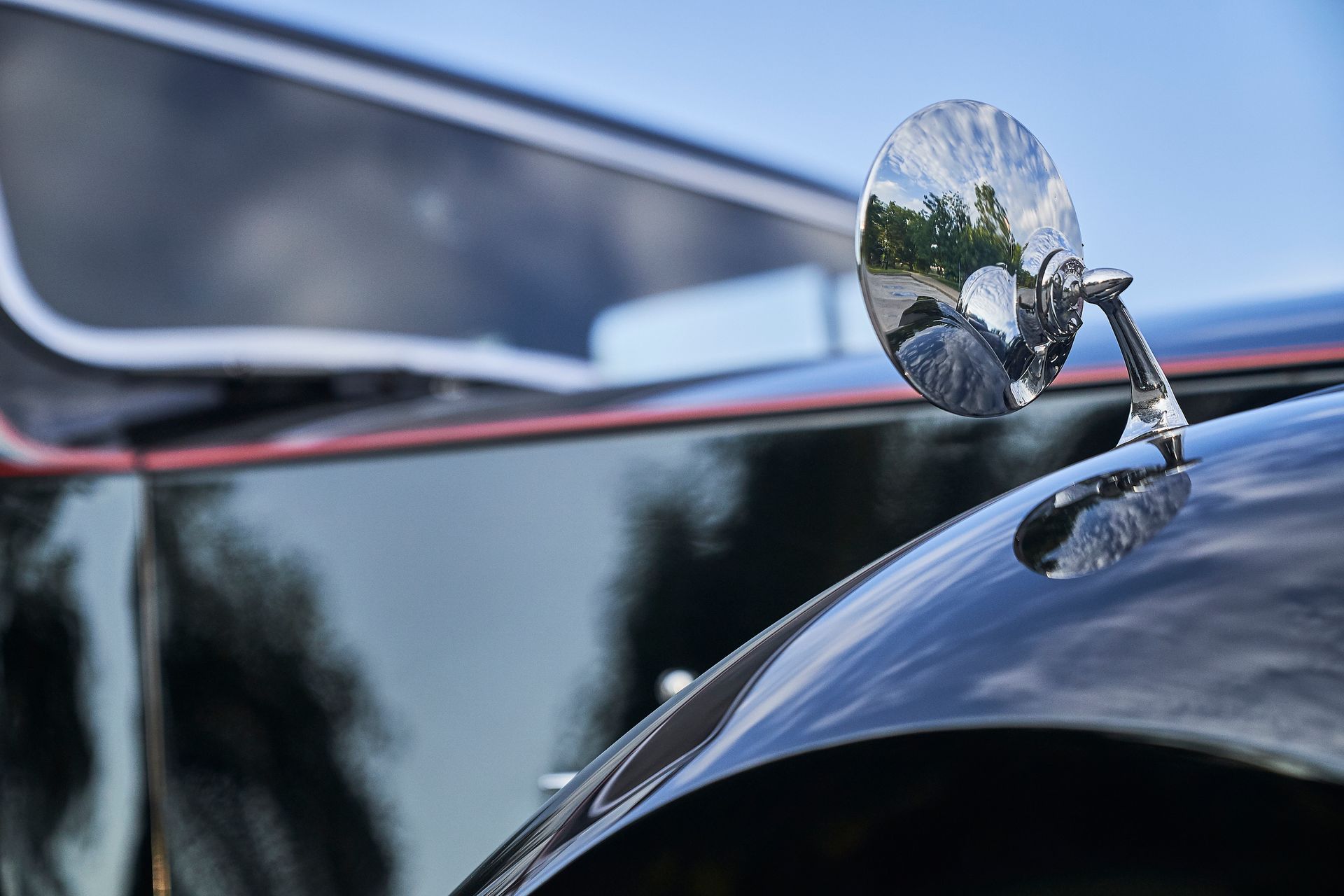A close up of a car with a side mirror on it.
