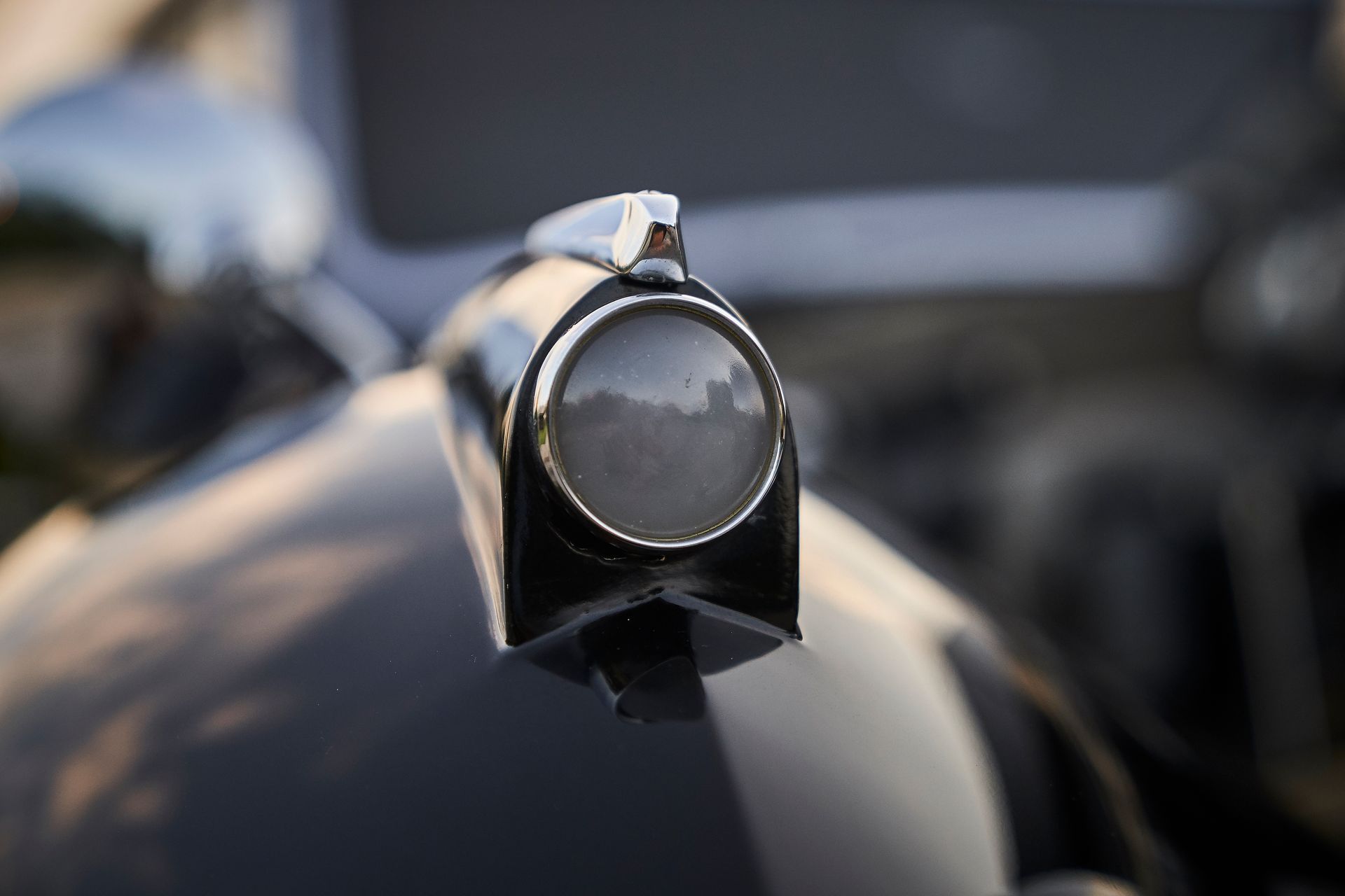 A close up of a hood ornament on a car