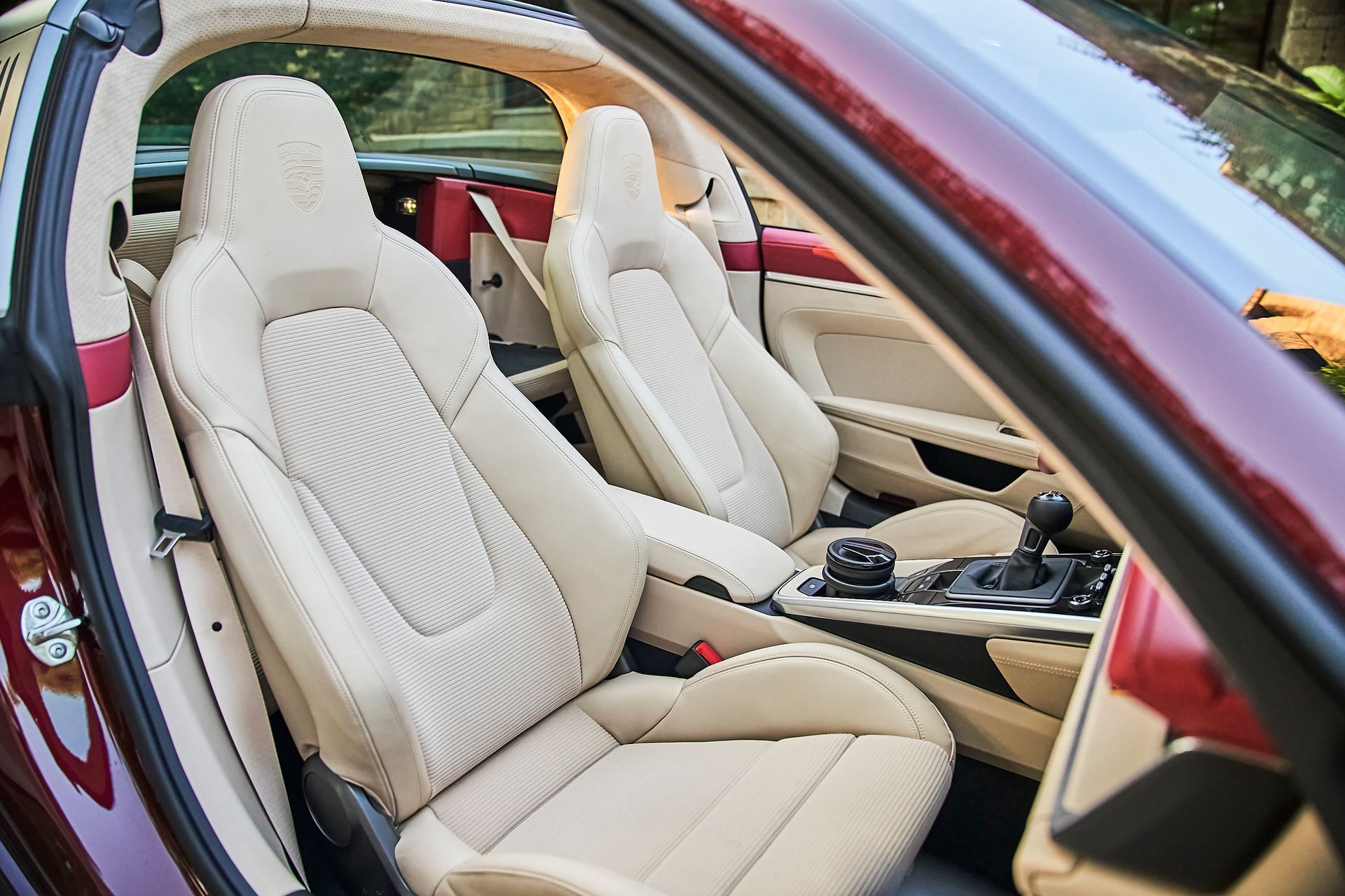 The interior of a ferrari sports car with the door open