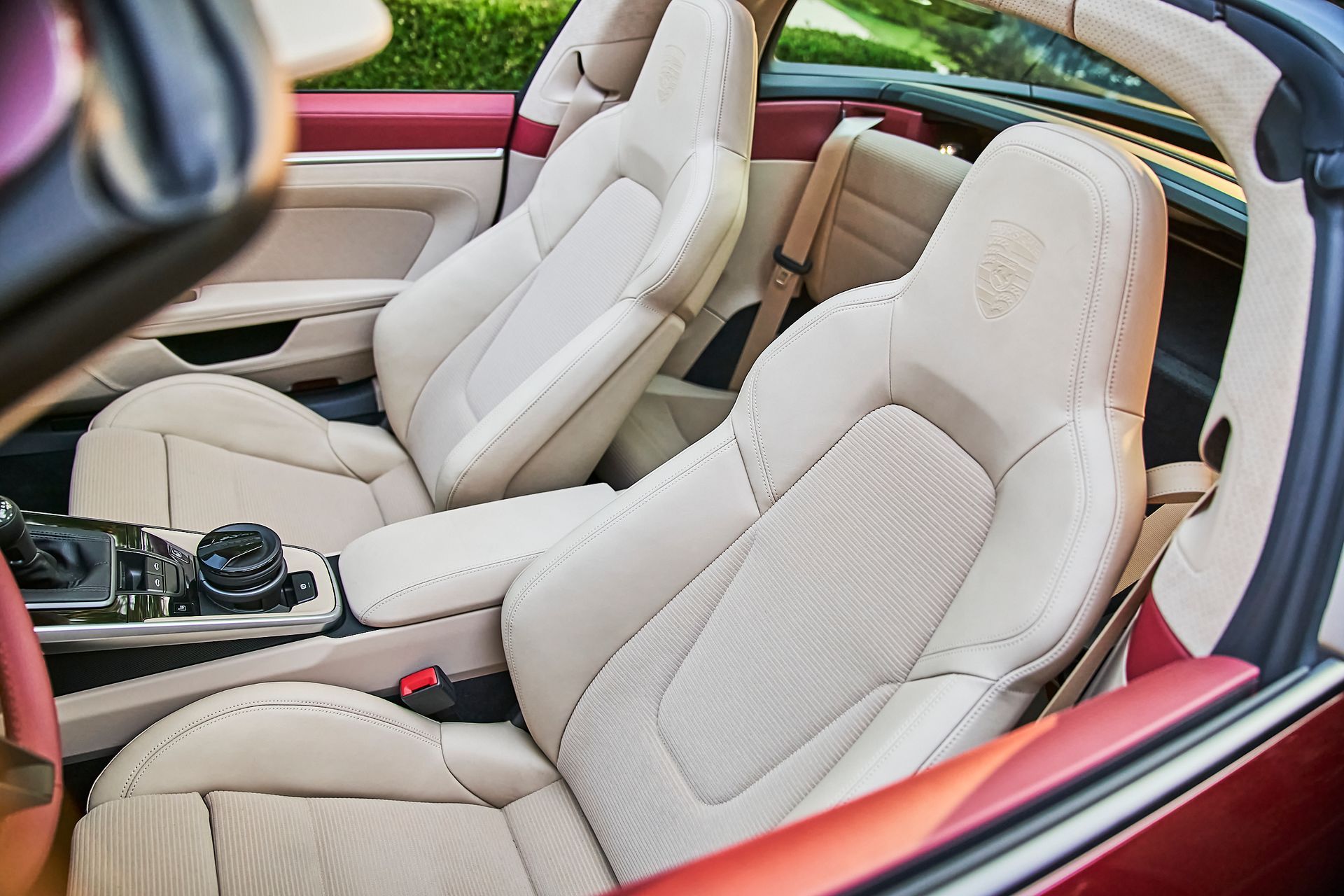 A close up of the seats in a convertible car.