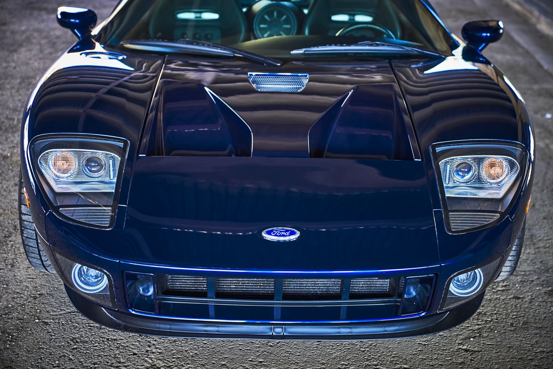 2006 Ford GT -A blue ford sports car is parked on the street
