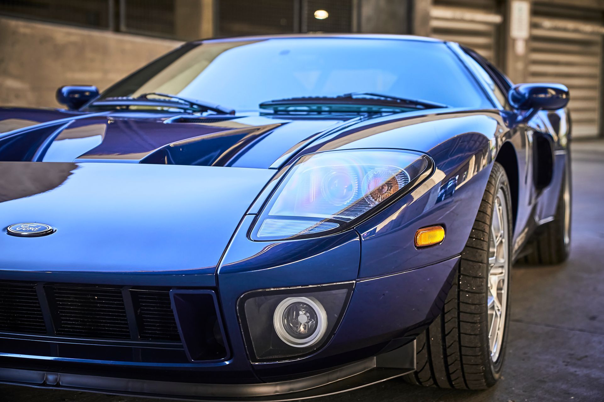 2006 Ford GT -A blue sports car is parked in a parking lot.