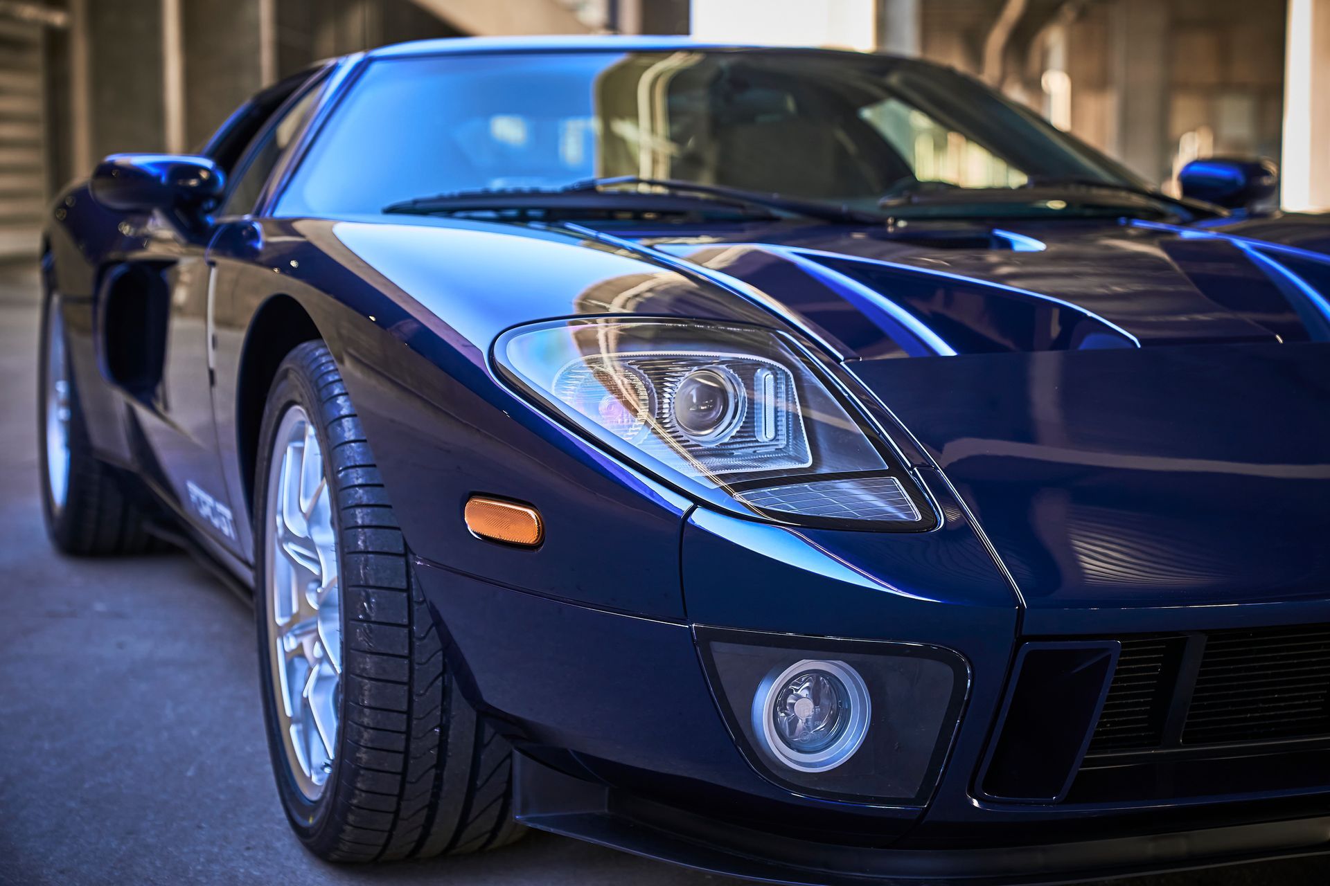 2006 Ford GT -A blue sports car is parked in a parking lot.