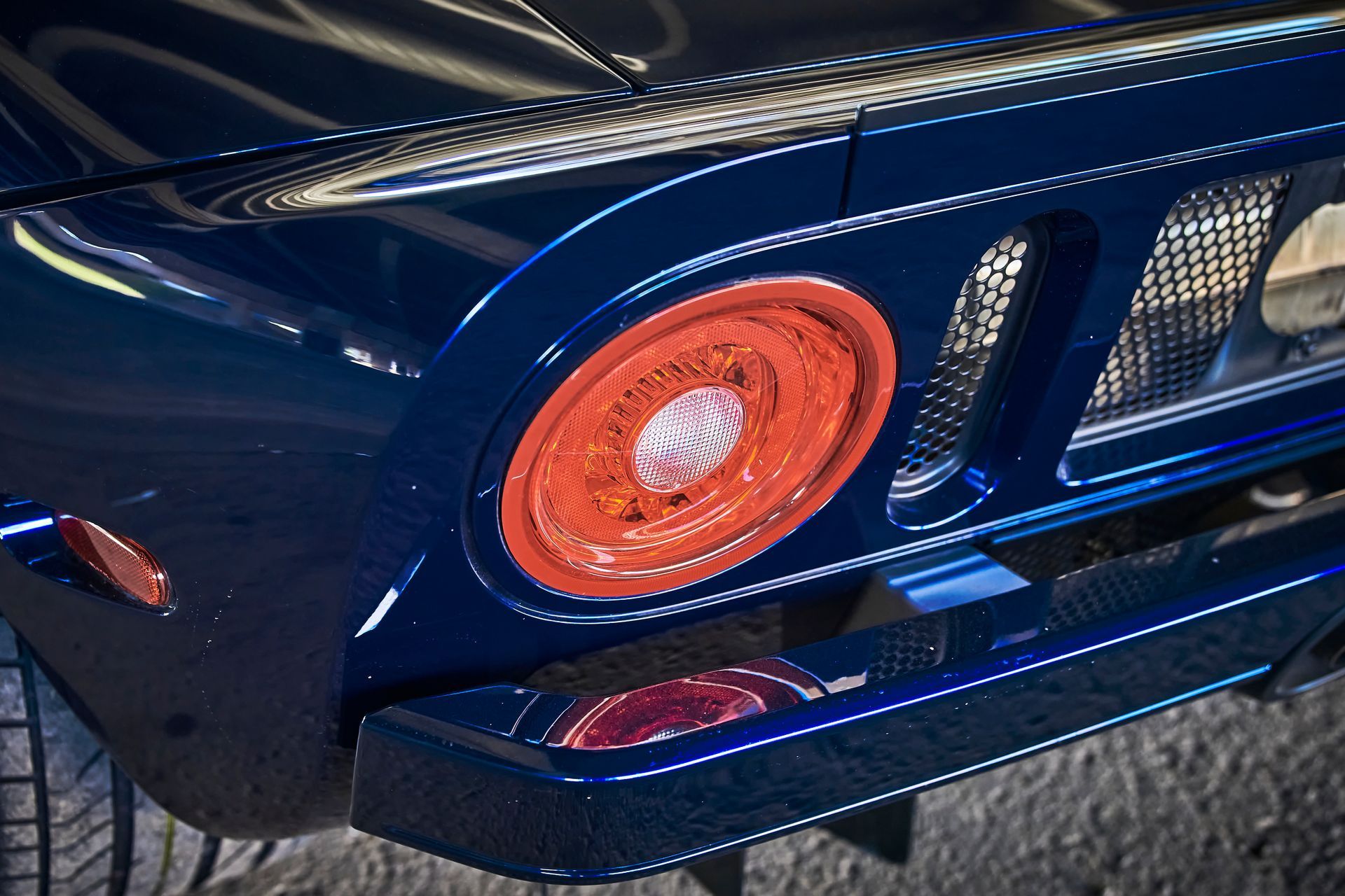 2006 Ford GT -A close up of a blue car with a red tail light