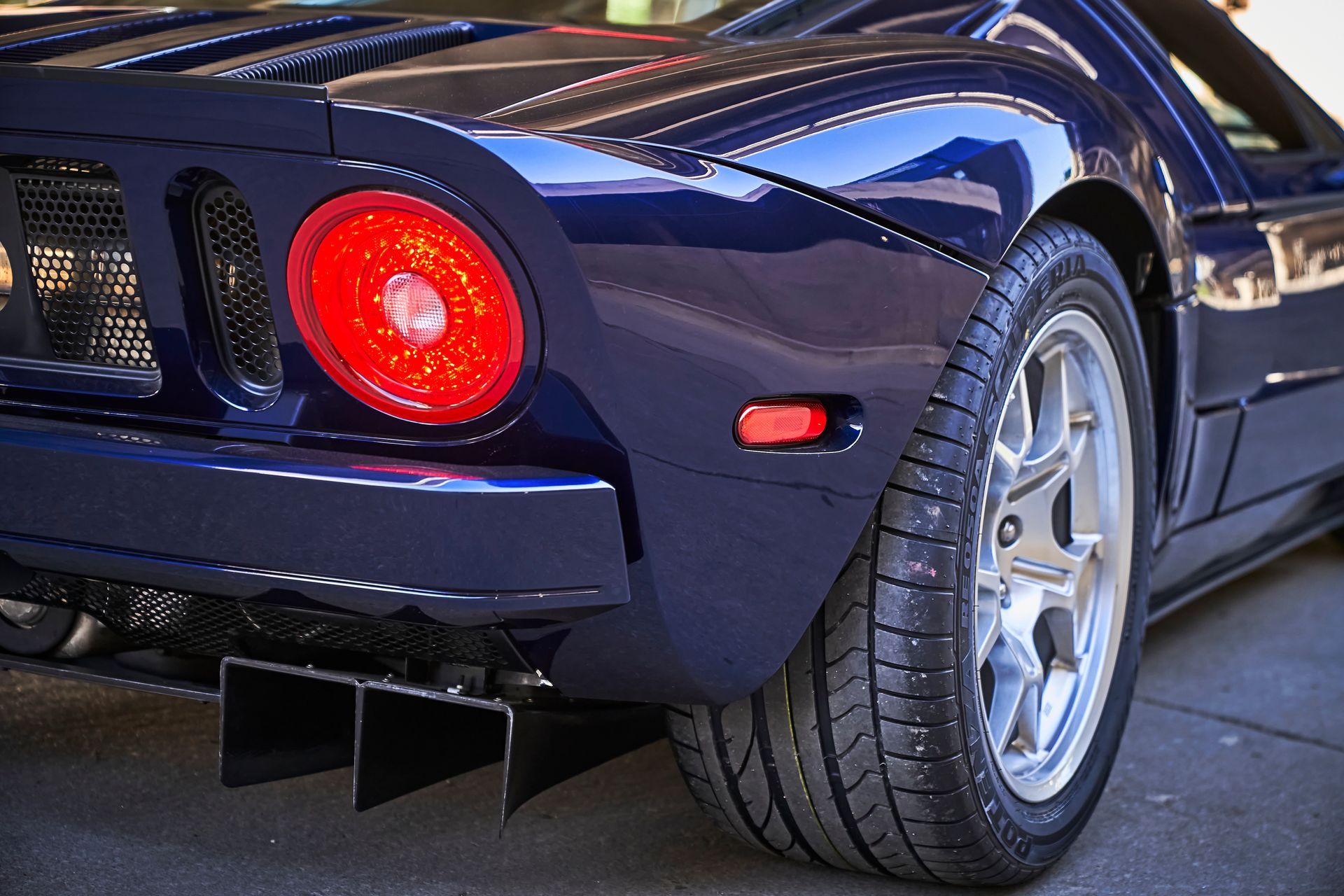 2006 Ford GT -A blue sports car with a red tail light