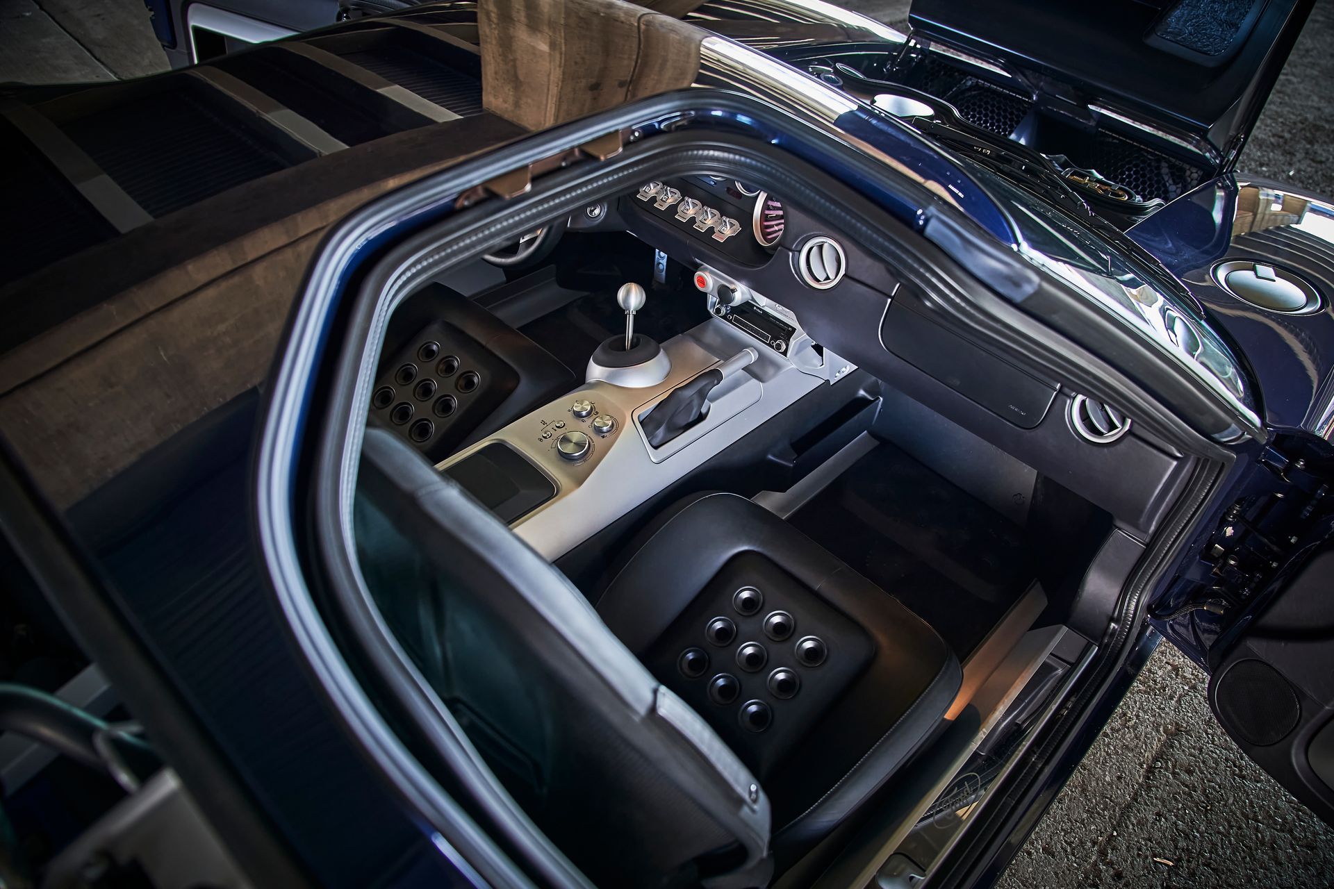 The inside of a car with the door open