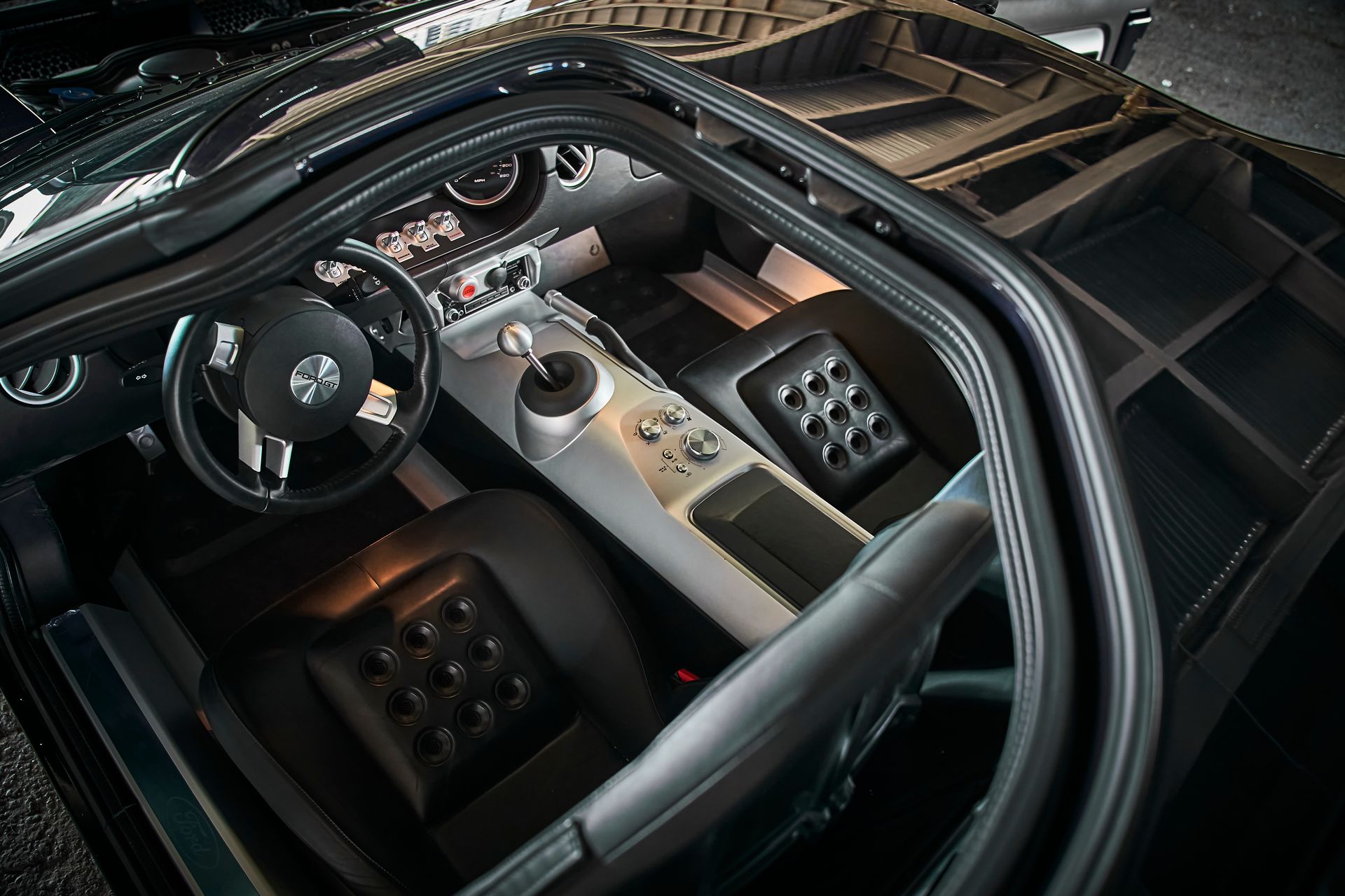 A close up of the interior of a car with the door open
