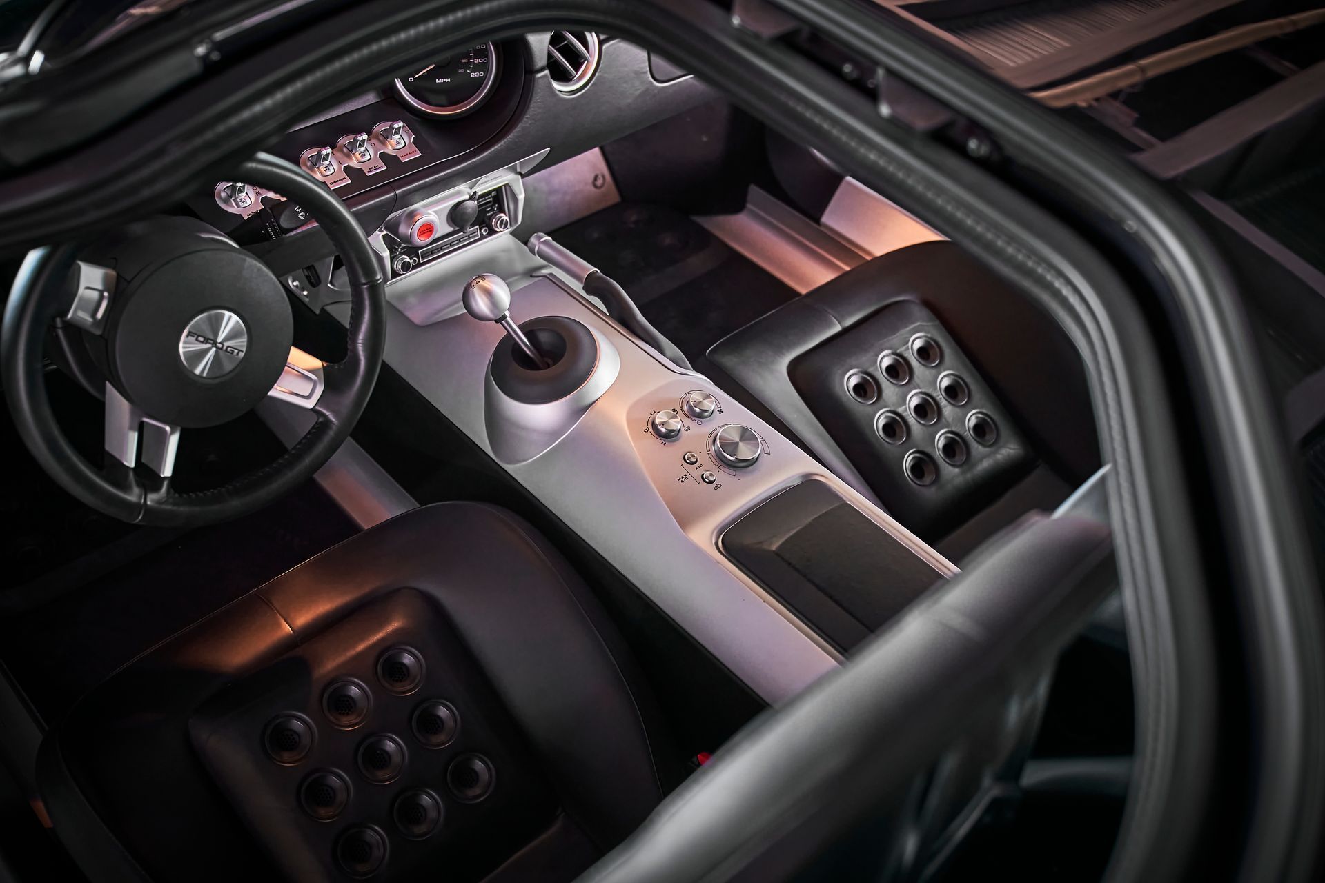 A close up of the interior of a car with the door open