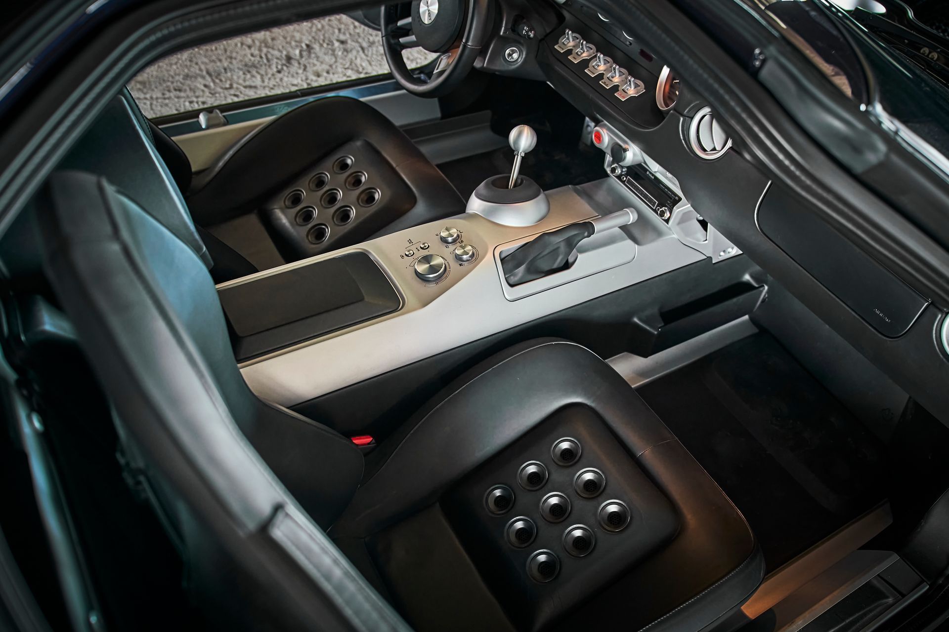 A close up of the interior of a car with the door open