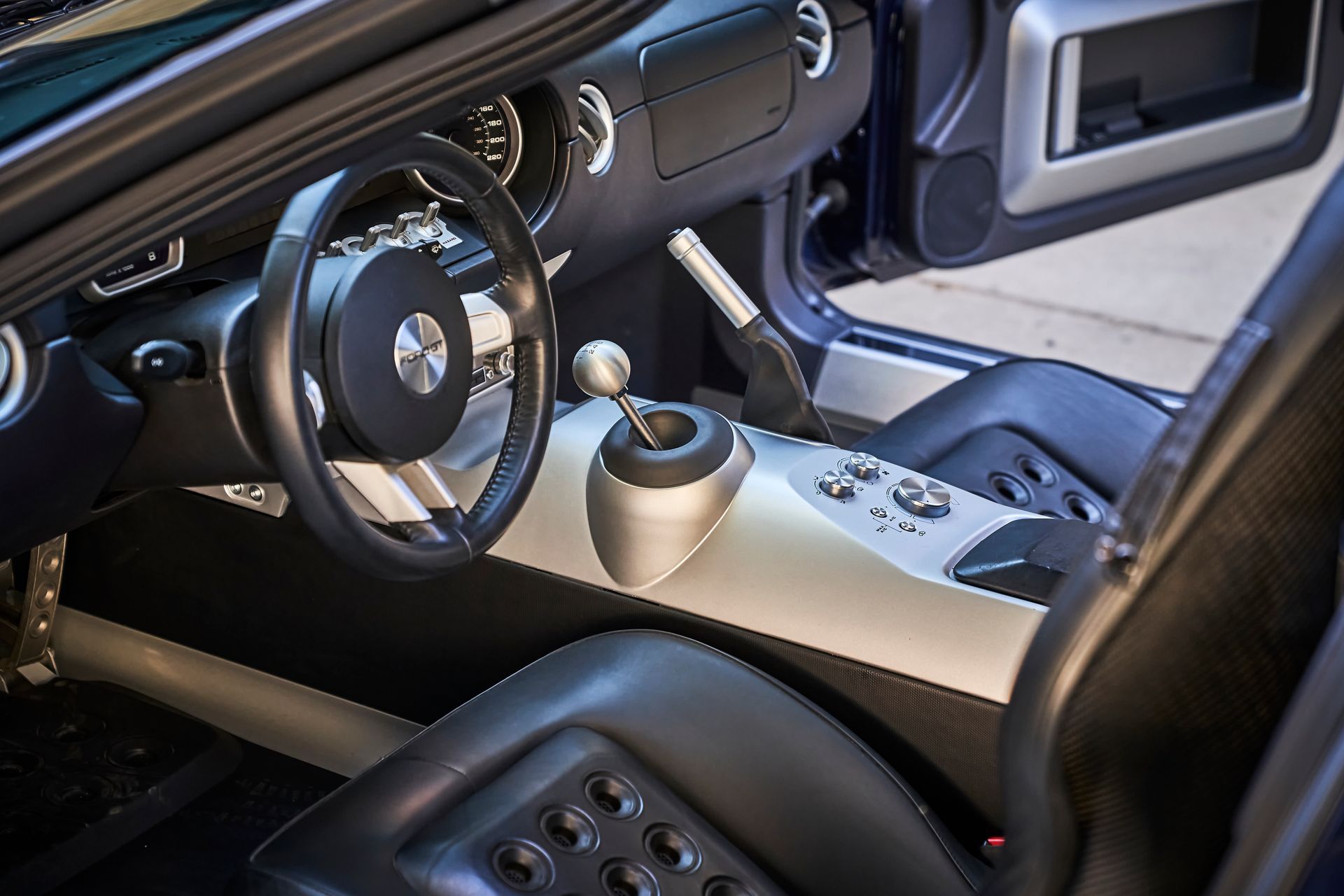 A close up of the interior of a car with the door open