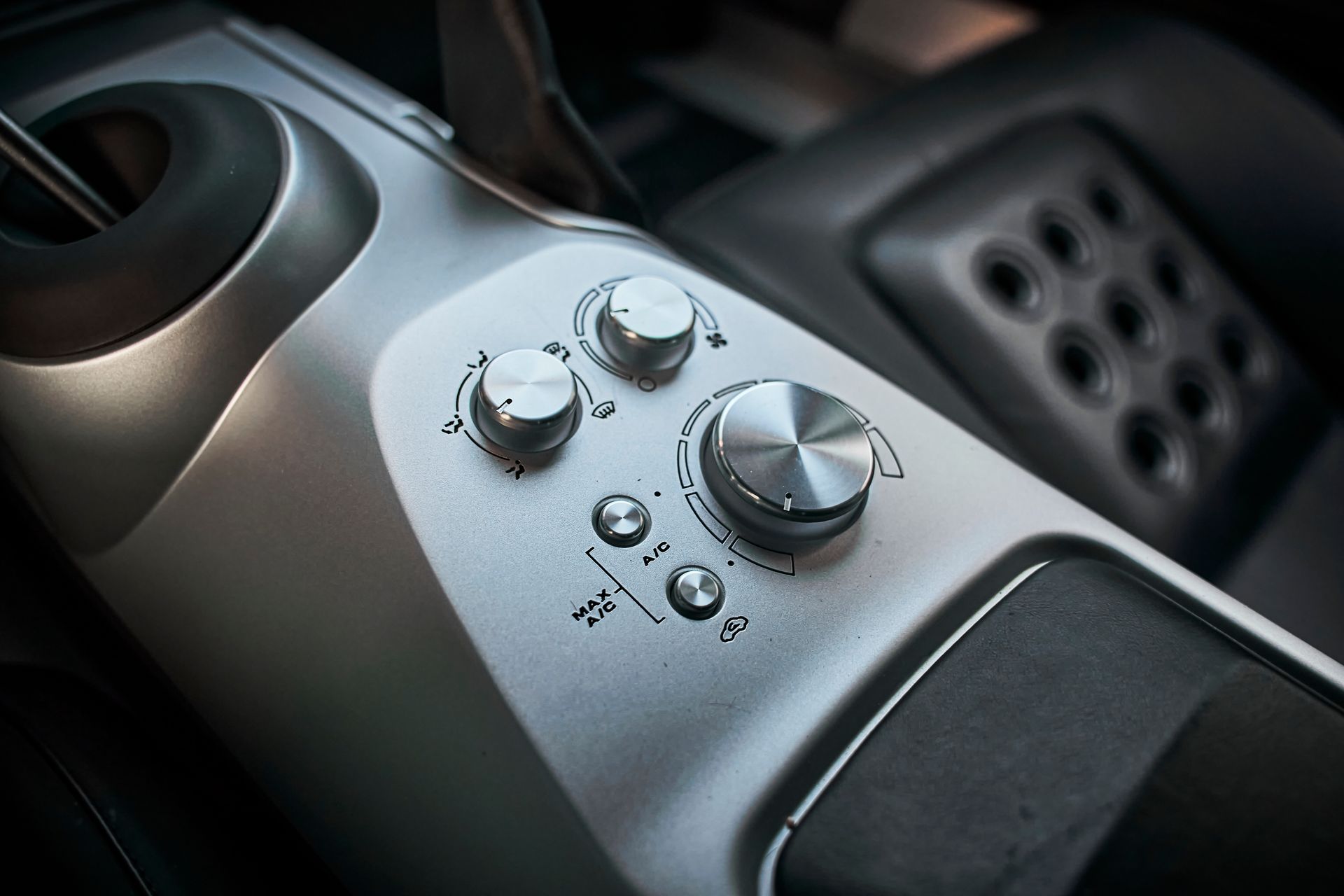 A close up of a control panel in a car