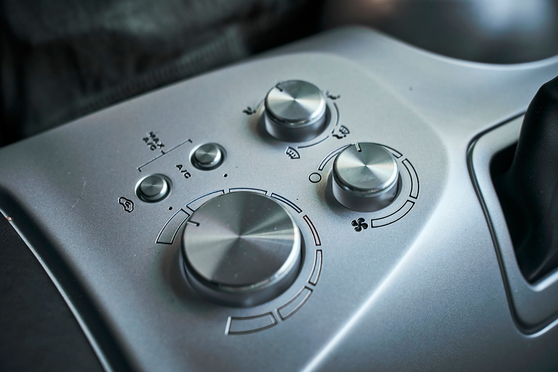 A close up of a steering wheel with a bunch of buttons on it