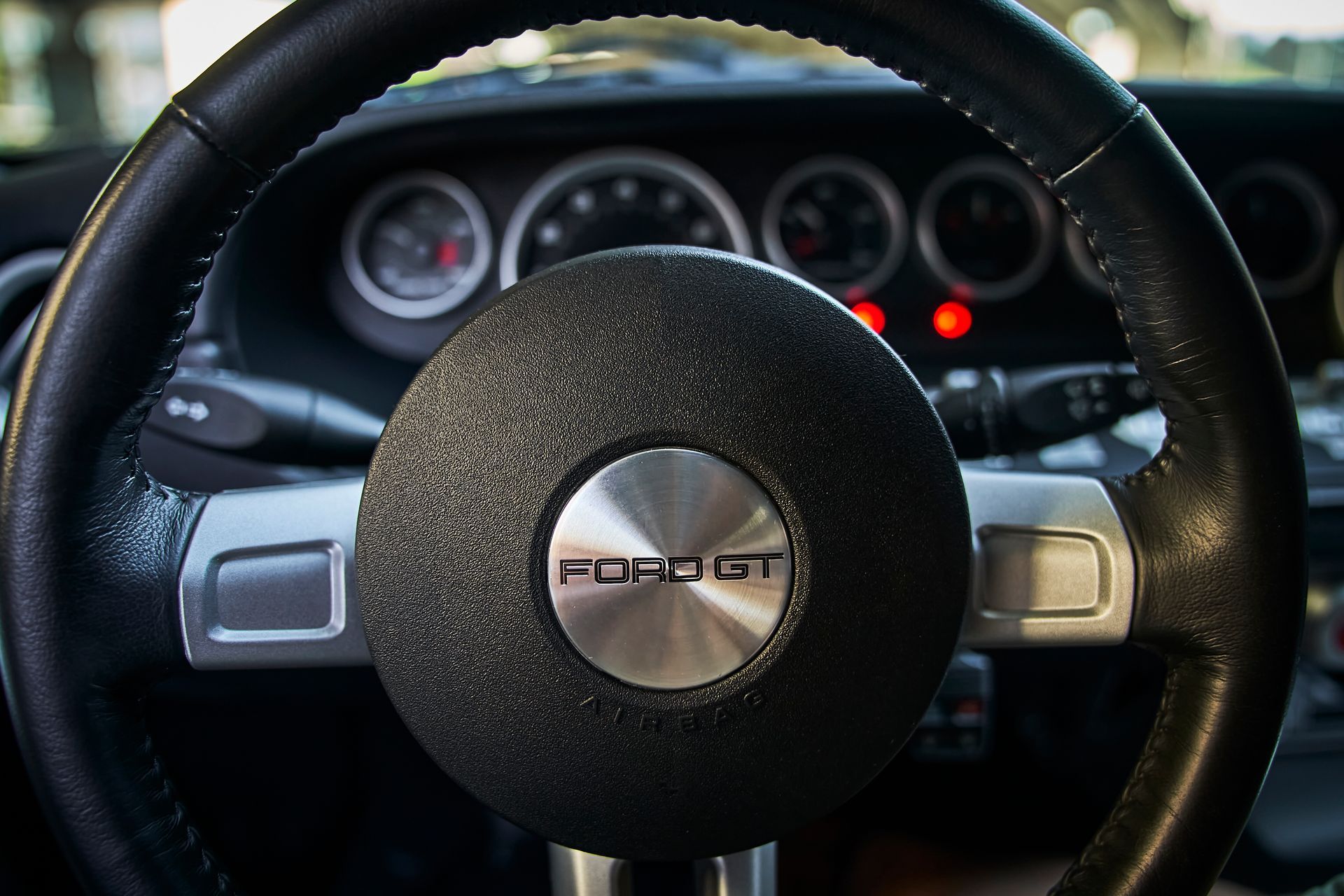 A close up of a steering wheel with the word gt on it