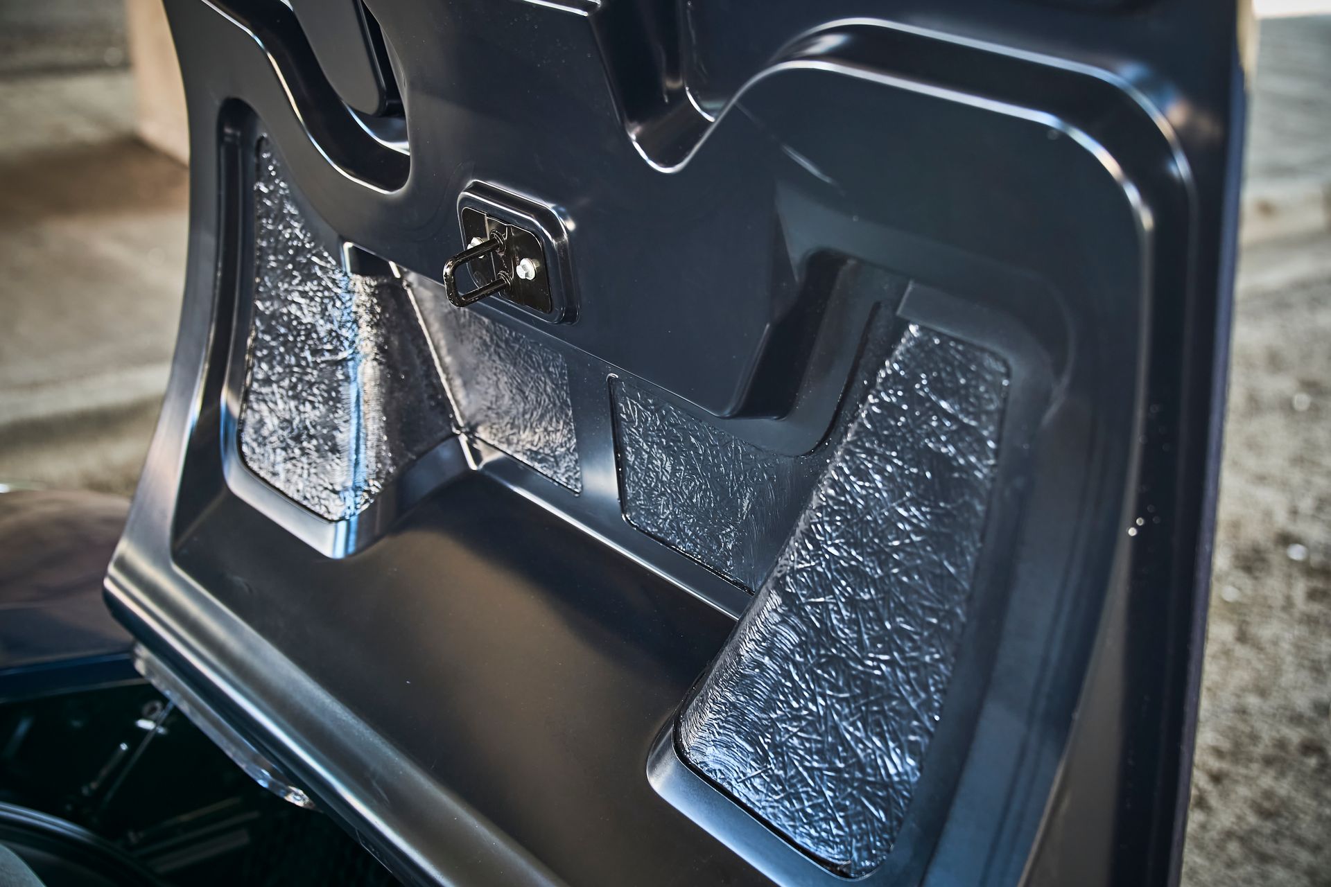 A close up of the trunk of a black vehicle