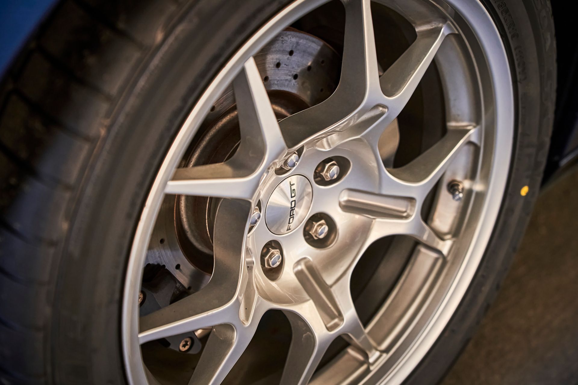 A close up of a car wheel with a tire on it