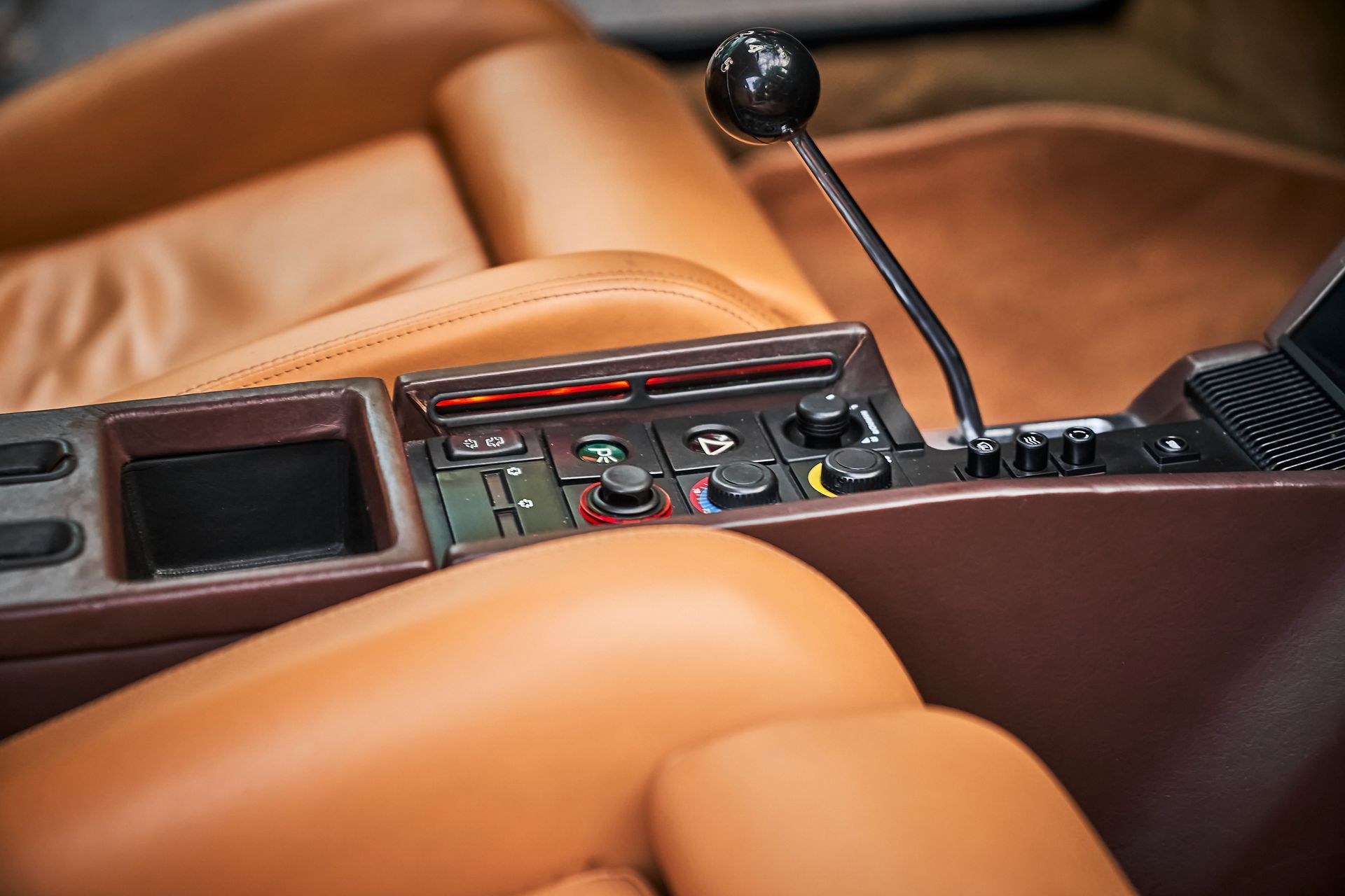 A close up of a steering wheel in a car.