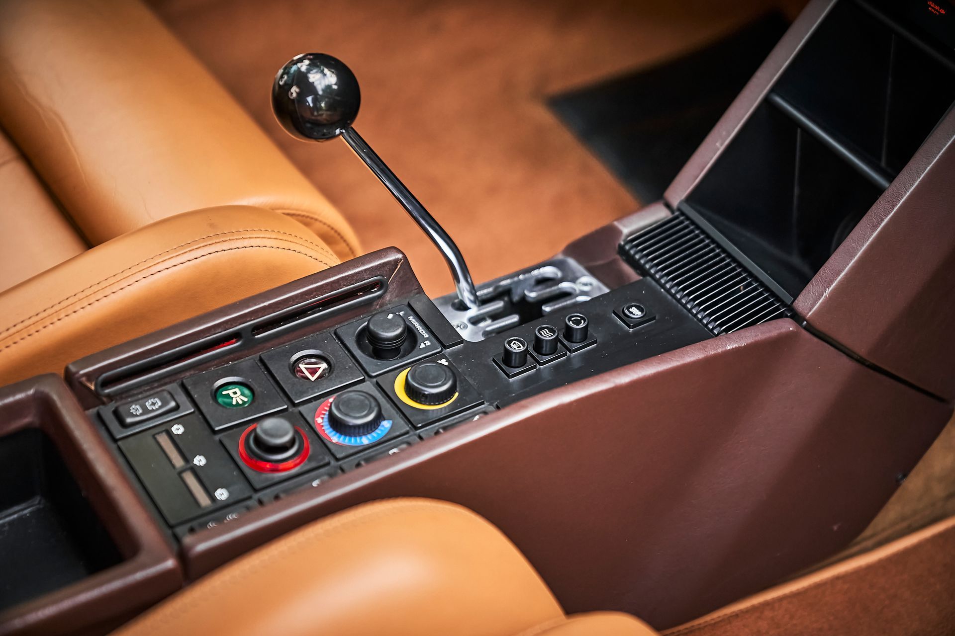 A close up of a steering wheel in a car.