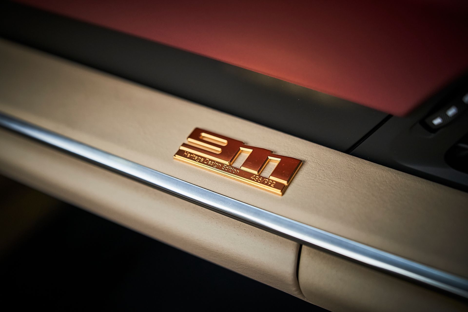 A close up of a 911 emblem on a car