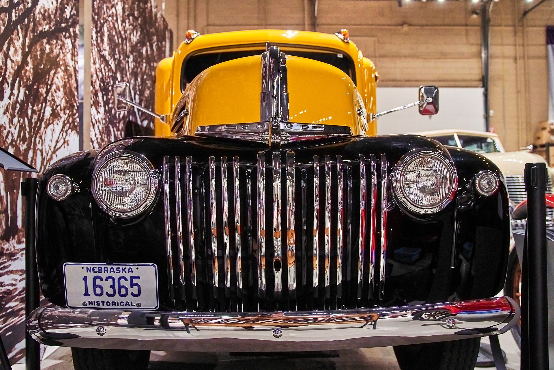 A yellow car with a license plate that says 16365