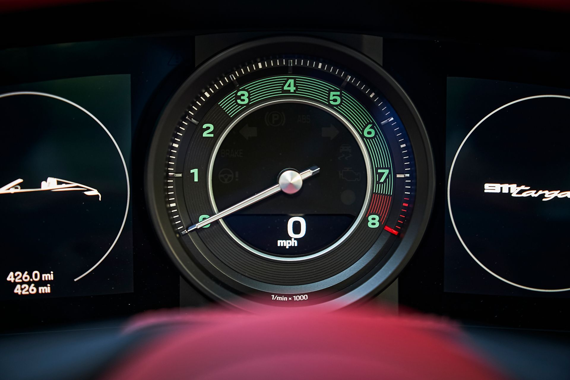 A close up of a speedometer in a car