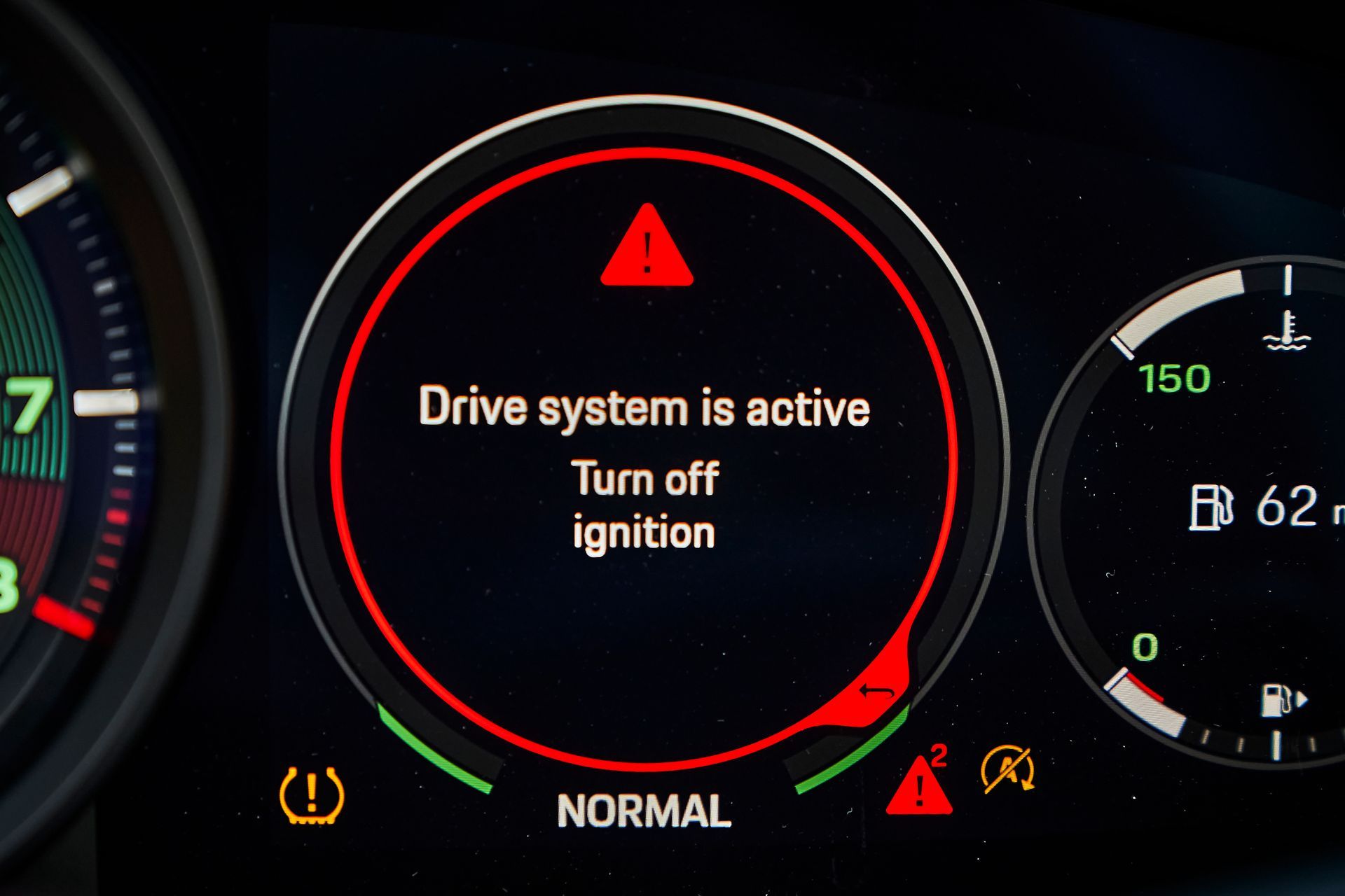 A car dashboard that says drive system is active turn off ignition